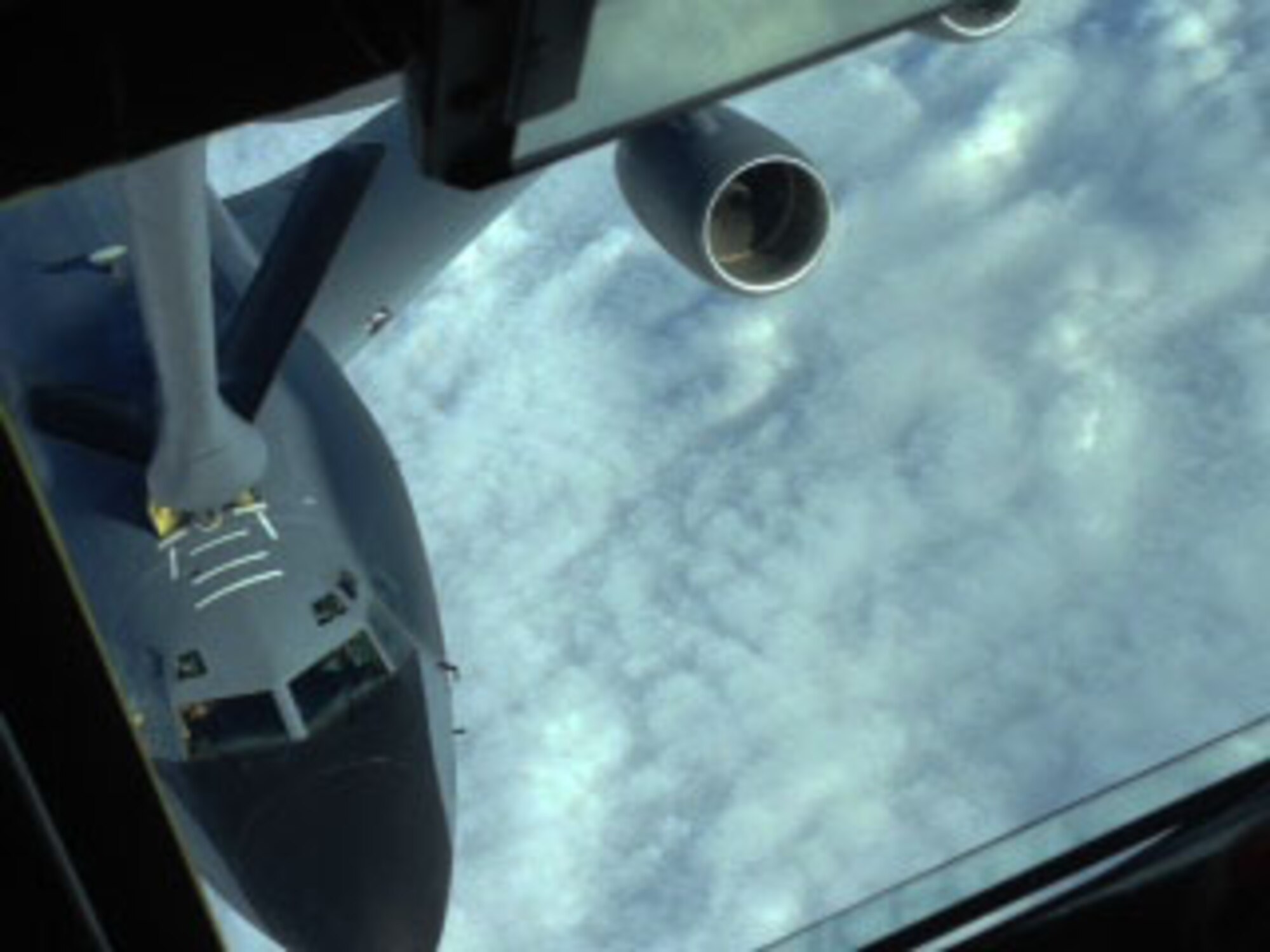 A KC-135 Stratotanker assigned to McConnell Air Force Base, Kan., refuels another KC-135 during a air refueling demonstration, Feb. 4, 2015.  The KC-135 serves as the core of the Air Force’s air refueling fleet and has performing in this role for more than 50 years.  (U.S. Air Force Photo by Tech. Sgt. Abigail Klein)
