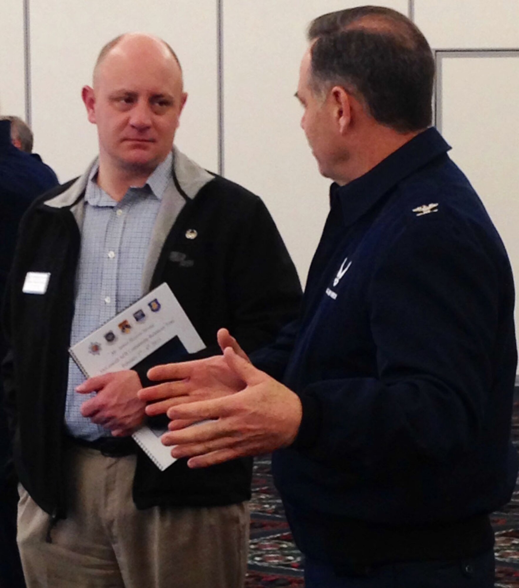 Col. Mark S. Larson, 931st Air Refueling Group commander, speaks with James Havers-Strong, ABI Group of Companies CEO and managing director and 931st ARG honorary commander, after a brief about the future of air refueling and the KC-46 Pegasus at Scott Air Force Base, Ill., Feb. 4, 2015.  The brief was conducted as part of a civic leader tour that included more than 20 business leaders from Wichita, Kan. (U.S. Air Force photo by Tech. Sgt. Abigail Klein)