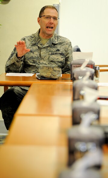 Chief Master Sgt. Stanley Cadell, 436th Airlift Wing command chief, answers questions at the Patterson Dining Facility during the Food Forum on Feb. 4, 2014, at Dover Air Force Base, Del. The forum provided information to the base population on the upcoming Food Transformation Initiative and allowed interested parties to pose questions to leadership while sampling some food items which will soon be added to the menu. (U.S. Air Force photo/Greg L. Davis)