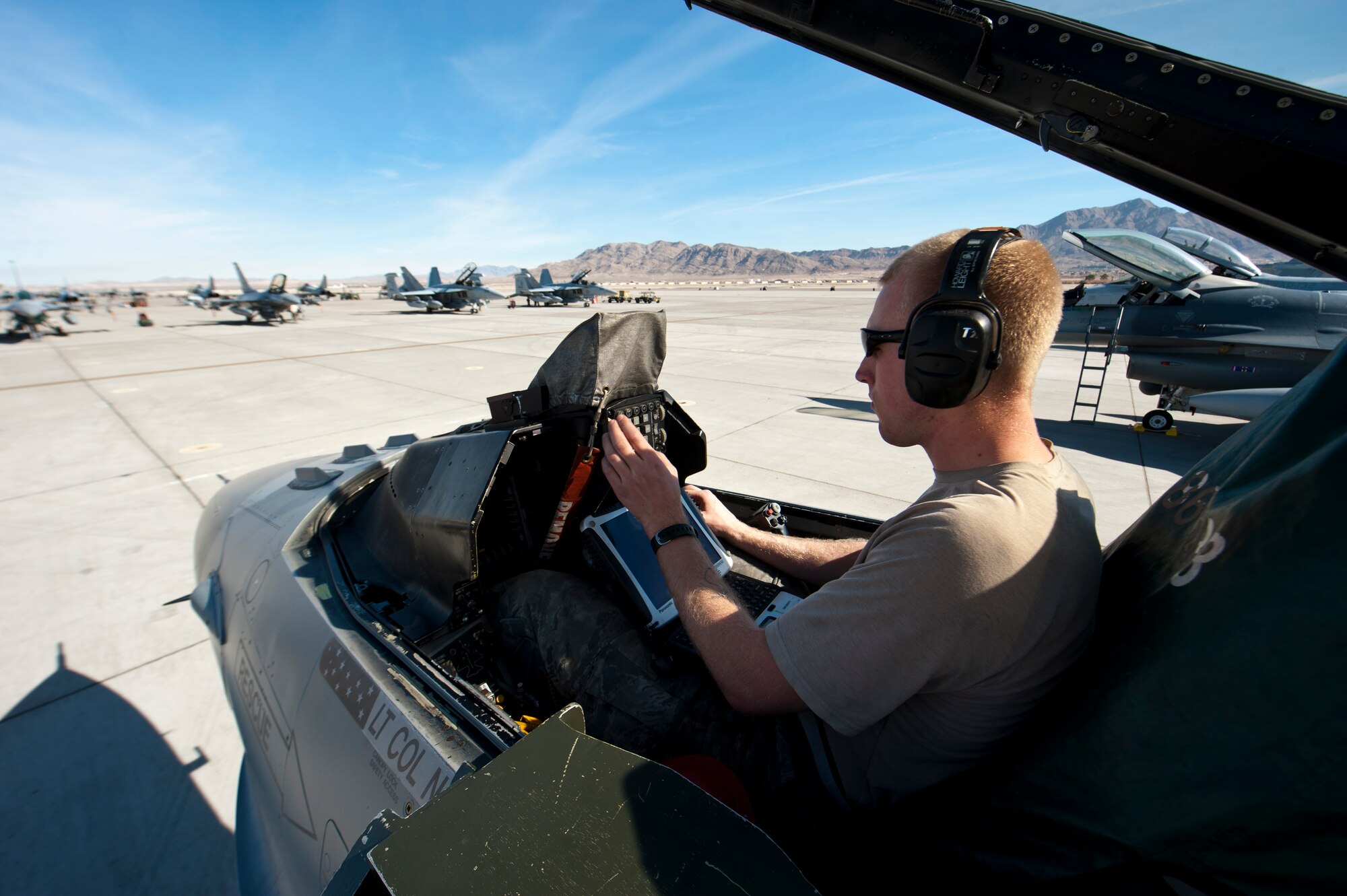 Vermont Air National Guardsman Staff Sgt. Josh Mitchell, an F-16 Fighting Falcon avionics technician assigned to the 158th Fighter Wing, Burlington Air National Guard Base, Vt., performs a Global Positioning System operations check on an F-16 during Red Flag 15-1 at Nellis Air Force Base, Nev., Feb. 4, 2015. Red Flag is a realistic combat training exercise involving the air, space and cyber forces of the U.S. and its allies. It is conducted on the bombing and gunnery ranges on the Nevada Test and Training Range. (U.S. Air Force photo by Senior Airman Thomas Spangler)