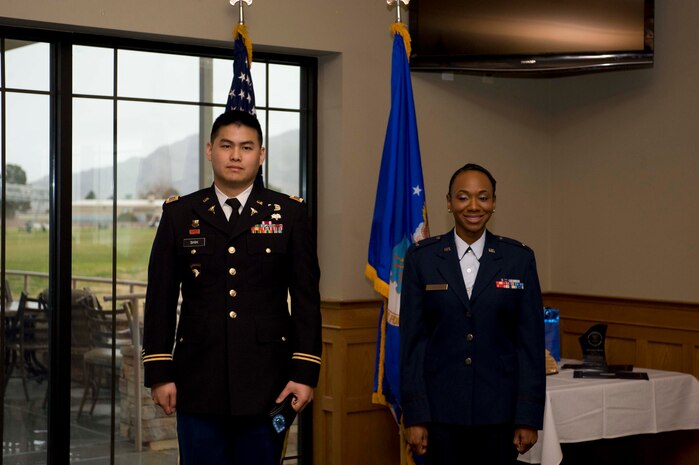 U.S. Army 1st Lt. Nan Shih and U.S. Air Force 1st Lt. Sade Savage graduated from the Inter-service Physician Assistant Program class 03-12 during a ceremony at the Sunrise Vista golf course on Nellis AFB, Nev., Jan. 30, 2015. Shih and Savage graduated as first lieutenants, with a Master of Physician Assistant Studies from the University of Nebraska Medical Center. (U.S. Air Force photo by Airman 1st Class Mikaley Towle)