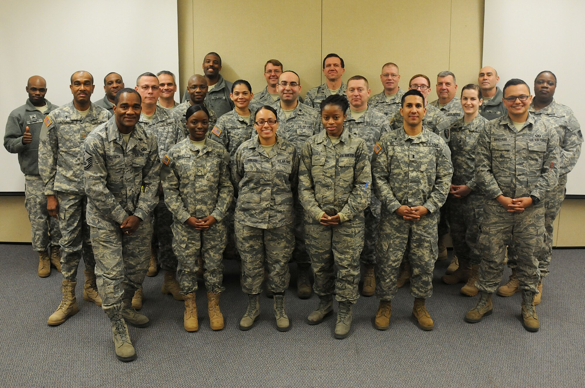 Army and Air Force chaplains and chaplain assistants from all over N.J., pose for a picture at the end of the Traumatic Event Management Course Jan. 16, 2015, at Joint Base McGuire-Dix-Lakehurst, N.J. The Army's TEM course was a week long and focused on unit cohesion and effectiveness to help manage crisis situations. The course used group activities and role playing to reinforce the lessons. At the end of the week, the students are able to take what they learned and bring it back to their units. (U.S. Air National Guard Photo by Airman 1st Class Julia Pyun/Released)