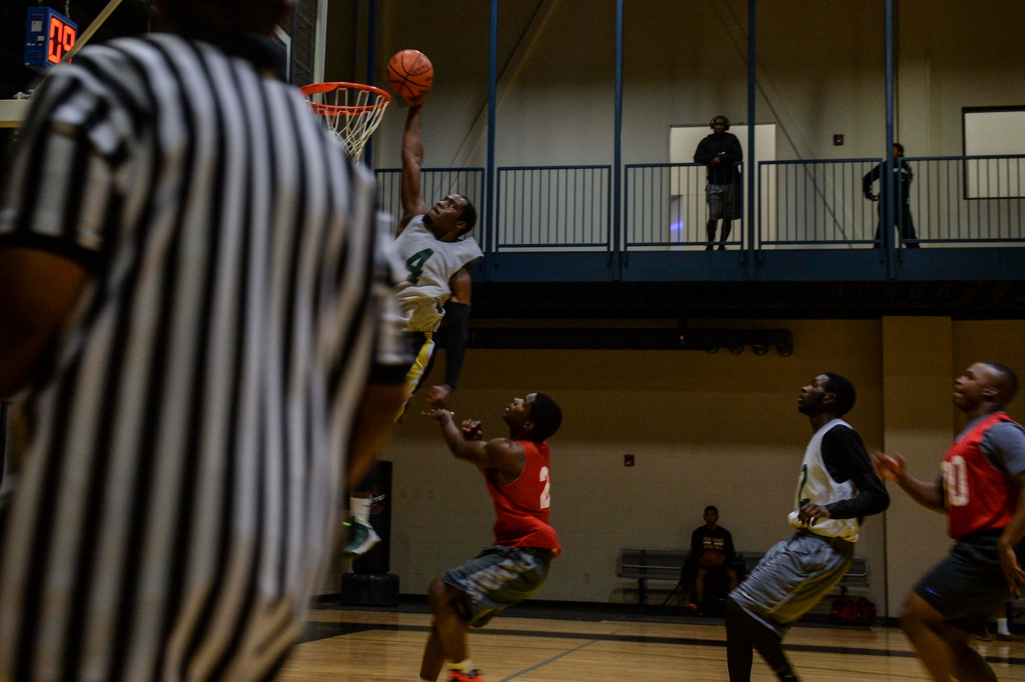Bryan Coleman, a guard for the 314th Aircraft Maintenance Squadron, attempts a slam dunk on a fast break opportunity during intramural basketball, Feb. 2, 2014, at Little Rock Air Force Base, Ark. (U.S. Air Force photo/Senior Airman Cliffton Dolezal)