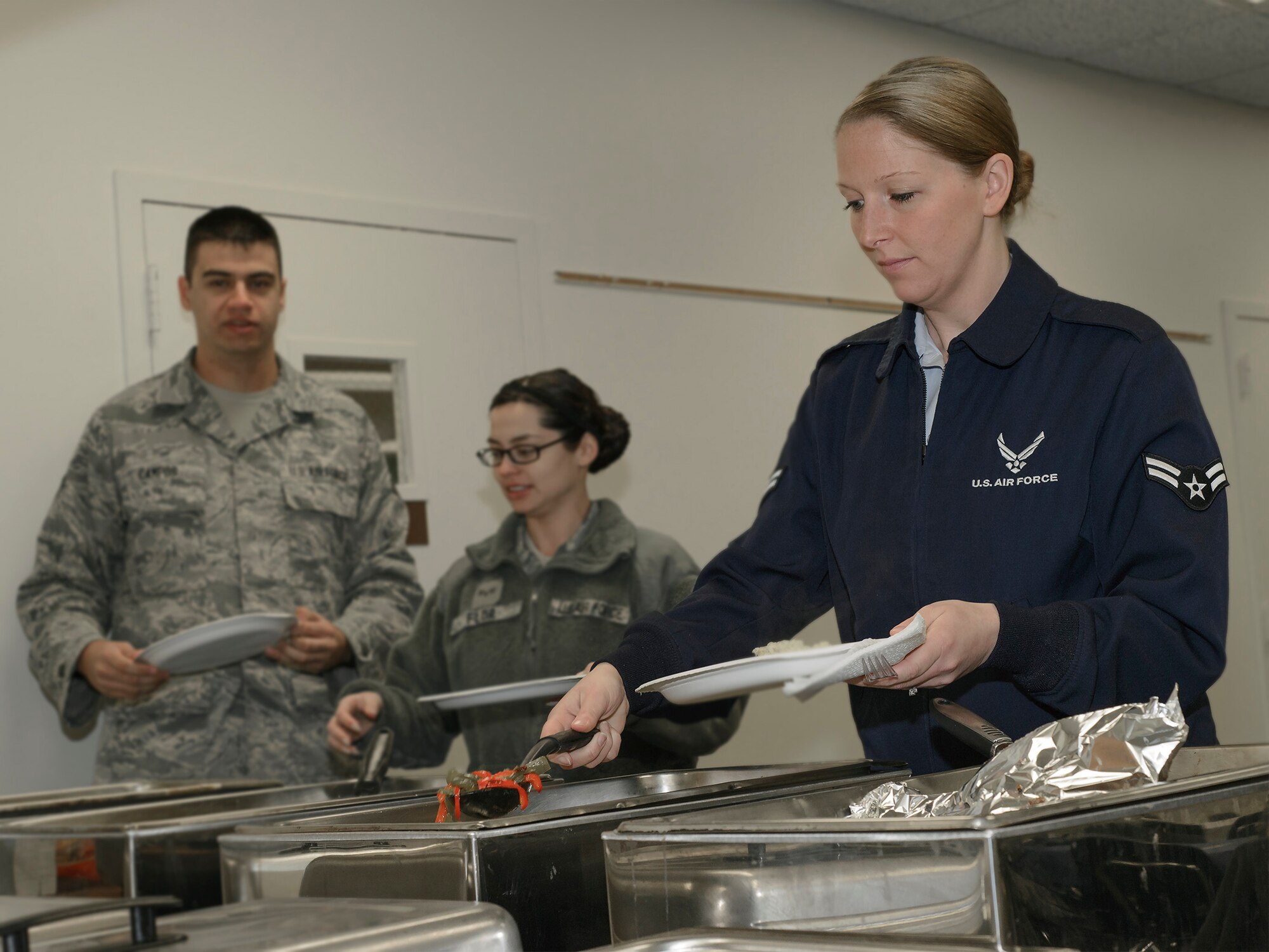 VANCE AIR FORCE BASE, Okla. -- Airman 1st Class Kibby Anglin, a 71st Operations Support Squadron air traffic controller, builds a breakfast burrito at the Community Chapel Activity Center Feb. 2. Team Vance gathered at the CCAC for the 2015 Air Force Assistance Fund campaign kickoff breakfast, which started the six-week drive. For more information on AFAF, visit www.afassistancefund.org. (U.S. Air Force photo / David Poe)