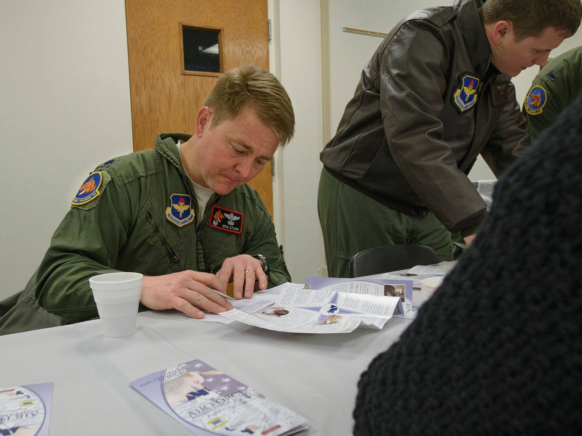 VANCE AIR FORCE BASE, Okla. -- Lt. Col. Michael Starr, the 33rd Flying Training Squadron commander, fills out his Air Force Assistance Fund contribution form at the Community Chapel Activity Center Feb. 2. Leaders from across the base joined fellow Team Vance Airmen and civilians for the campaign's kickoff breakfast. (U.S. Air Force photo / David Poe)