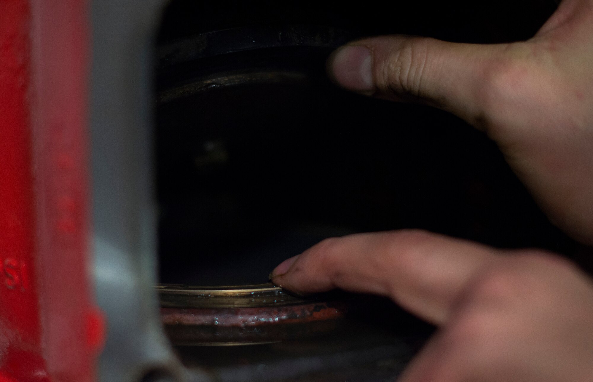 Staff Sgt. Benjamin Schultz, 786th Civil Engineer Squadron fire suppression team lead, performs an internal inspection of an alarm valve to ensure it is clean and fully functional at Ramstein Air Base, Germany, Jan. 29, 2015. The 786th CES Airmen inspects fire suppression systems on a monthly basis to ensure that if there were a fire, the system would operate as designed. (U.S. Air Force photo/Senior Airman Damon Kasberg)