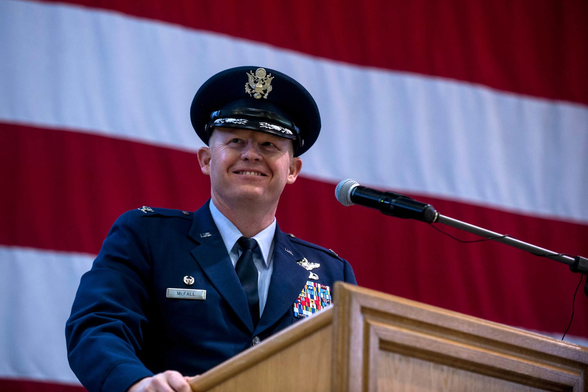 U.S. Air Force Col. Joseph McFall, 52nd Fighter Wing commander, speaks during an assumption of command ceremony Feb. 5, 2015, in Hangar 1 at Spangdahlem Air Base, Germany. McFall is a U.S. Air Force Academy graduate with more than 2,500 flying hours in the F-16 Fighting Falcon fighter aircraft, including 795 hours of combat time during Operations Southern Watch, Northern Watch, Allied Force, Enduring Freedom and Iraqi Freedom. (U.S. Air Force photo by Senior Airman Rusty Frank/Released)