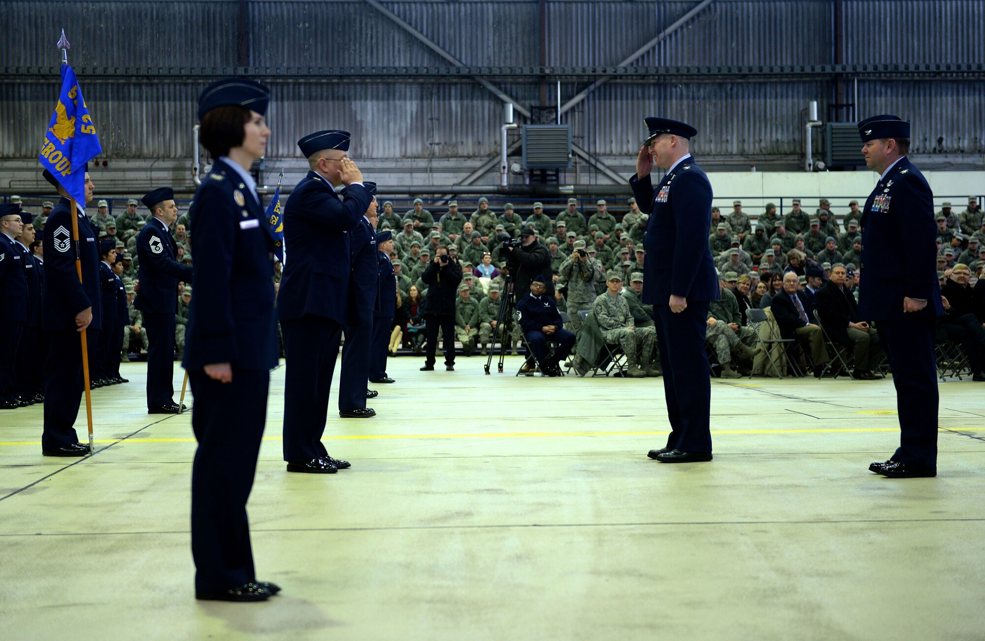 The 52nd Fighter Wing's group commanders, left, present their units to U.S. Air Force Col. Joseph McFall, right, 52nd FW commander, during the assumption of command ceremony in Hangar 1 at Spangdahlem Air Base, Germany, Feb. 5, 2015. One of the first acts a wing commander performs after accepting the responsibility is to inspect members of the wing. (U.S. Air Force photo by Staff Sgt. Daryl Knee/Released)
