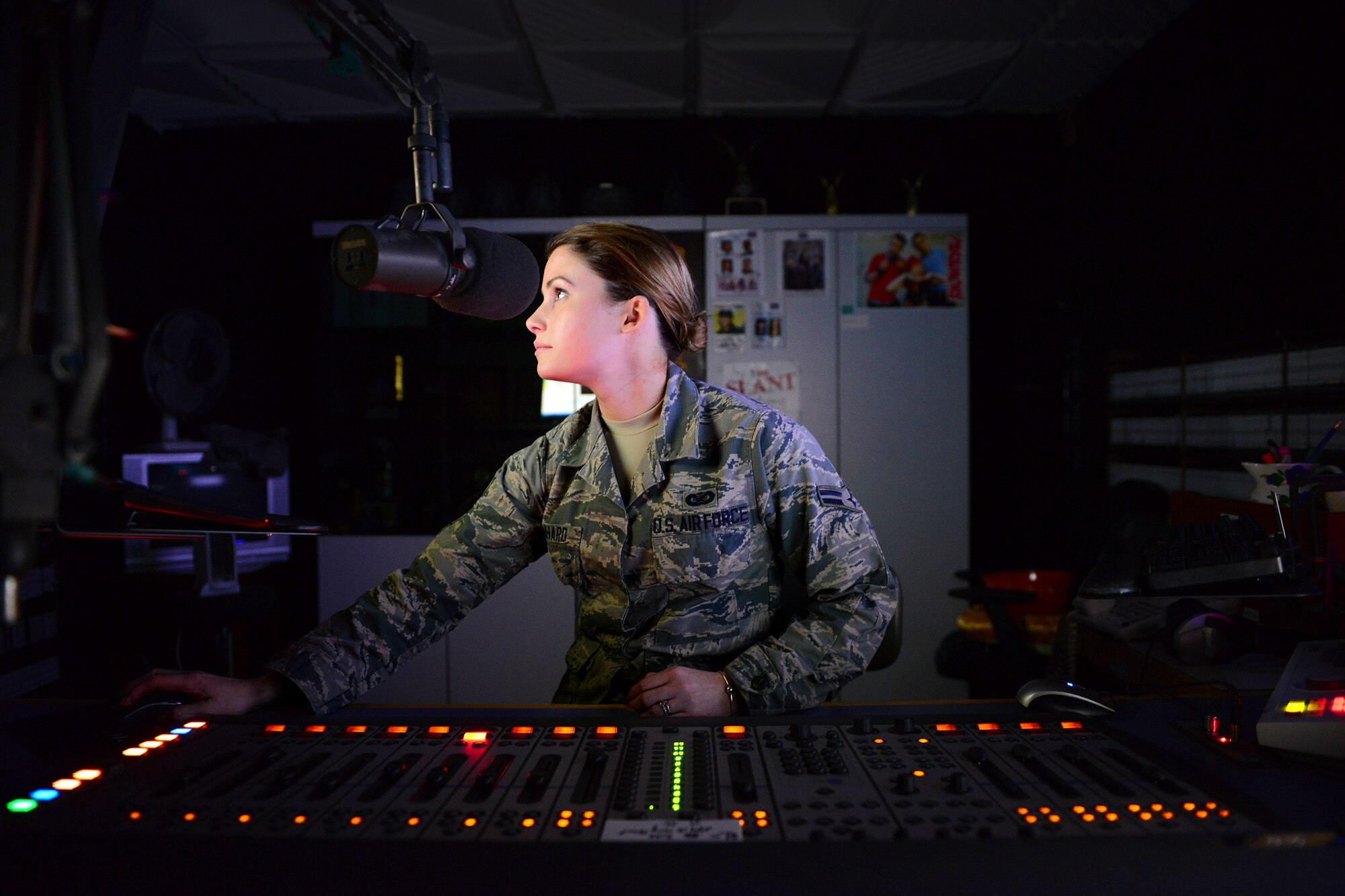 U.S. Air Force Airman 1st Class Katherine Leonhard, American Forces Network Europe broadcast journalist, searches for music during a radio show, Feb. 3, 2015, at Aviano Air Base, Italy. Across Europe, AFN Airmen, Sailors and Soldiers are responsible for providing command information, news and entertainment to Department of Defense personnel and families around the world. Listeners can receive important information affecting Aviano personnel from 31st Fighter Wing leadership Wednesday mornings from 7 to 8 a.m. (U.S. Air Force photo by Senior Airman Matthew Lotz/Released)