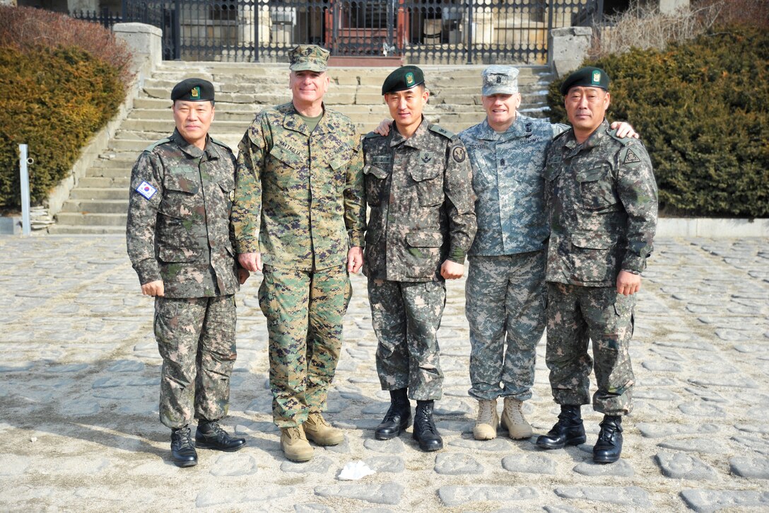 South Korean Command Sgt. Maj. Lee Gil-ho,  from left, U.S. Marine Corps Sgt. Maj. Bryan Battaglia, senior enlisted advisor to the chairman of the Joint Chiefs of Staff, South Korean Command Sgt. Maj. Woo Hyung-ko, South Korean 5th Corps, U.S. Army Command Sgt. Maj. John Troxell, senior enlisted advisor to U.S. Forces Korea, and South Korean Command Sgt. Maj. Seon Ho-yoon, South Korean 3rd Infantry Division, pose for a photograph after a tour at the demilitarized zone in Pocheon, South Korea, Feb. 4, 2015.