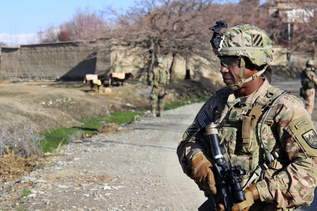 U.S. Army Command Sgt. Major Christopher Gilpin provides security during a patrol through a village in Parwan province, Afghanistan, Jan. 27, 2015. Gilpin is the senior enlisted advisor to the 3rd Infantry Division.