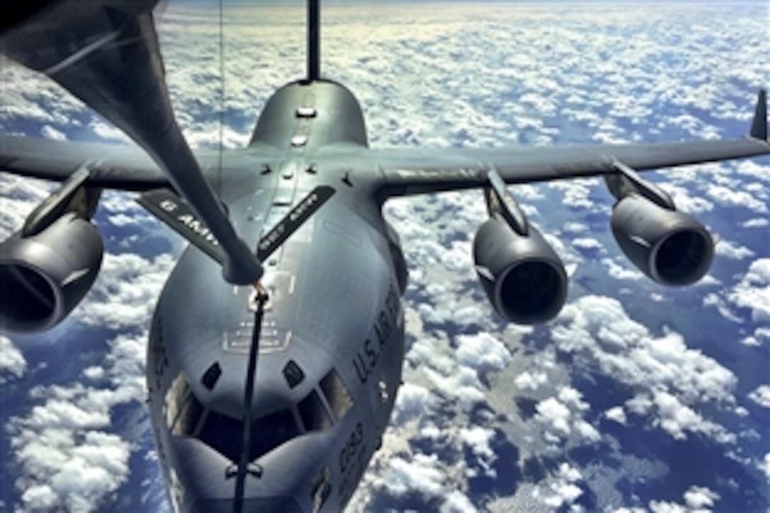 A KC-135 Stratotanker supplies fuel to a C-17 Globemaster during a pilot training mission off the coast of North Carolina, Feb. 3, 2015.

