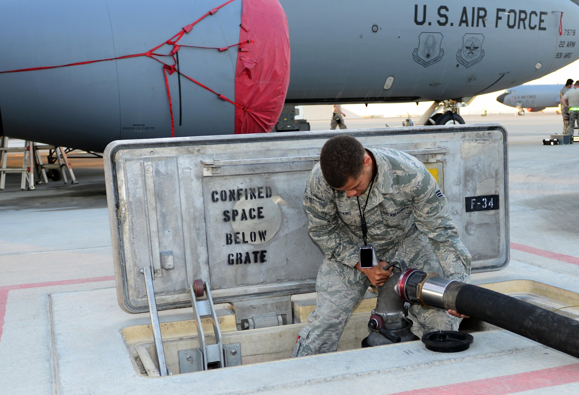 Airman 1st Class Jovonte Atkins, 379th Expeditionary Logistics Readiness Squadron fuels specialist, connects a hydrant coupler to a hydrant outlet to refuel an aircraft at Al Udeid Air Base, Qatar, Feb. 5, 2015. Since 2001, the 379th ELRS fuels flight has delivered more than three billion gallons of aviation and ground fuel in support of operations Enduring Freedom and Iraqi Freedom. (U.S. Air Force photo by Master Sgt. Kerry Jackson)