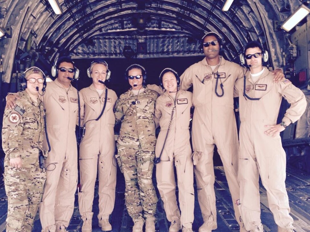 U.S. Air Force Airmen from the 379th Expeditionary Aeromedical Evacuation Squadron pose for a photograph before a flight. The mission of the 379th EAES is to transport wounded warriors to better echelons of care. (Courtesy photo)