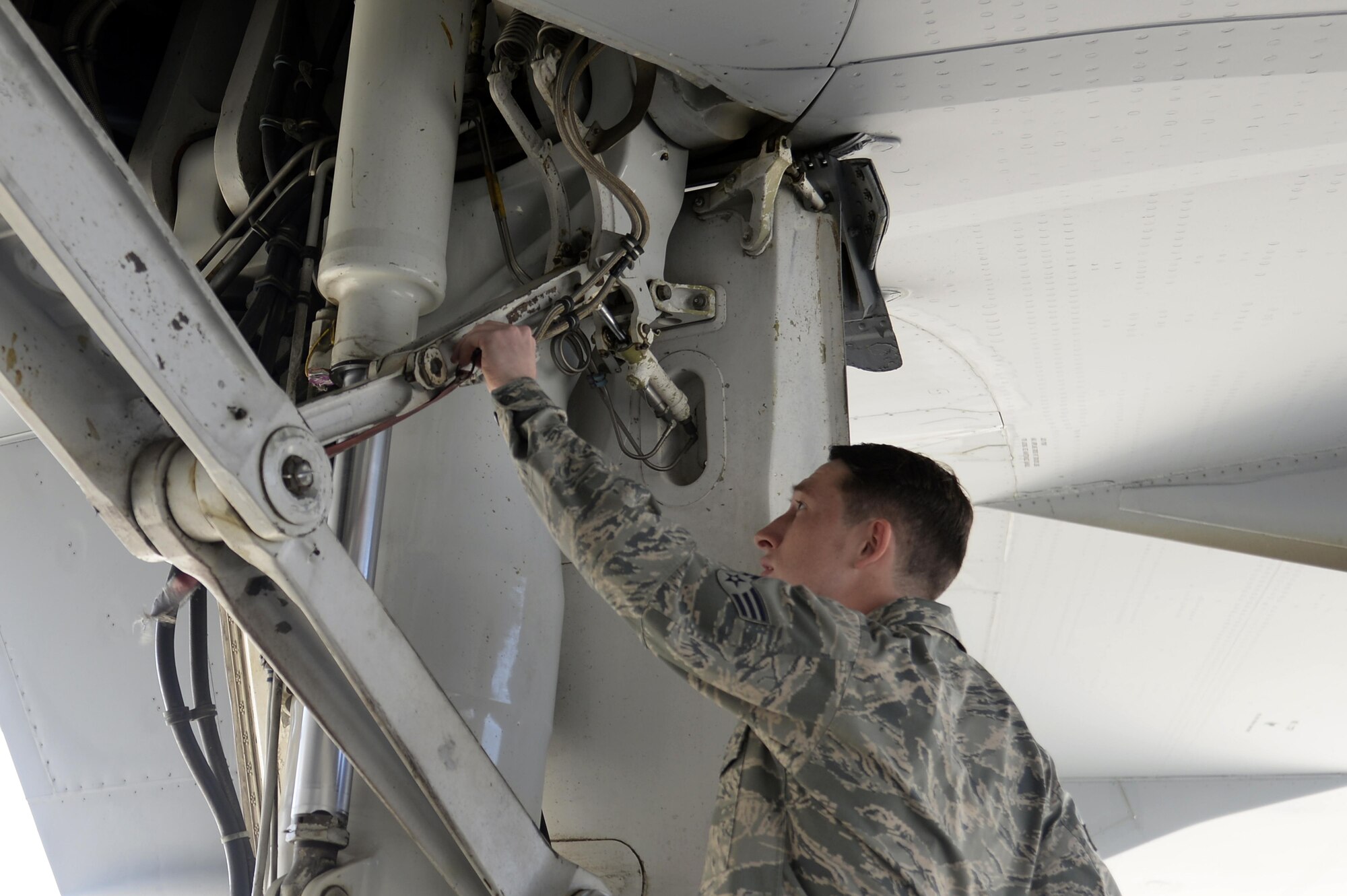 Senior Airman Will, KC-10 Extender instrument and flight control systems technician, preforms a preflight inspection on a KC-10 Extender at an undisclosed location in Southwest Asia Feb. 2, 2015. KC-10 Extenders deliver much-needed gas to help defend the nation, which begins with a hard-working team of Airmen consisting of crew chiefs and specialists. Will is deployed from Travis Air Force Base, Calif., and is a native of Glendale, Ariz. (U.S. Air Force photo/Tech. Sgt. Marie Brown)