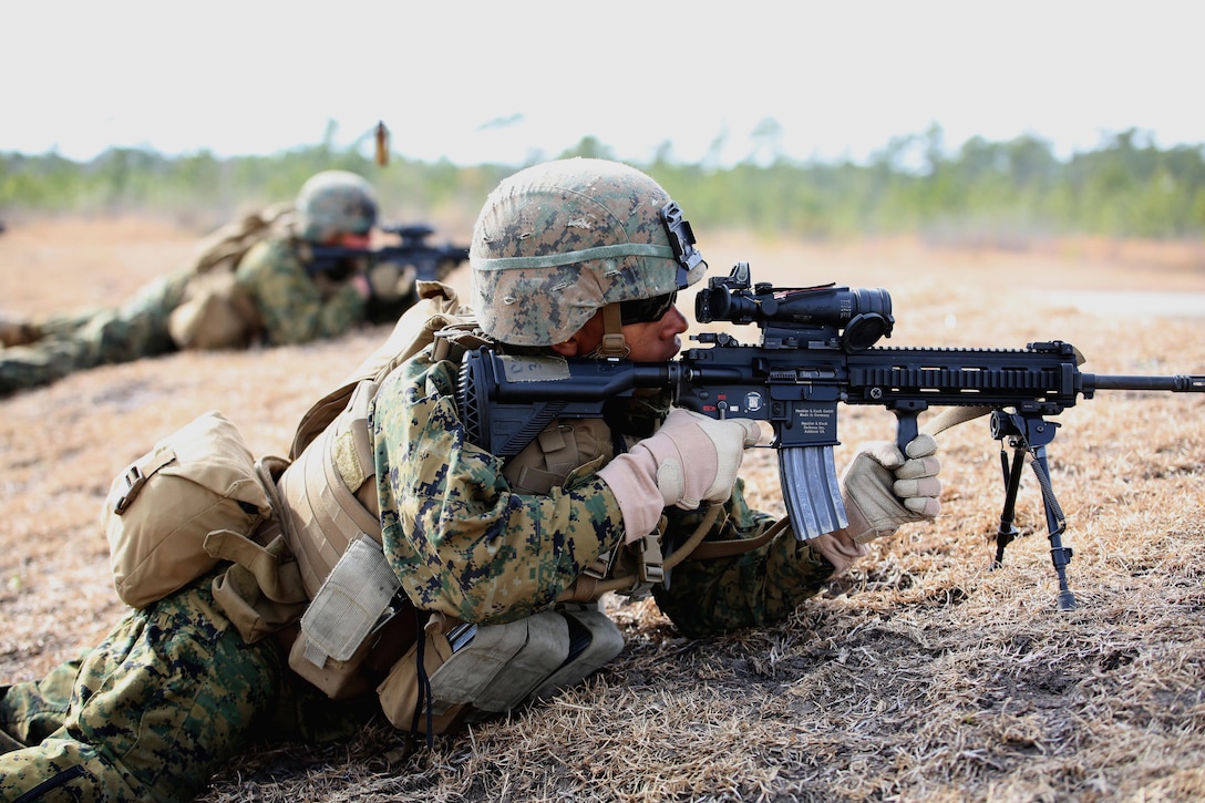 Lance Cpl. Jovan A. Stroud, automatic rifleman with 2nd Platoon, Company A, Ground Combat Element Integrated Task Force, engages targets with the M27 Infantry Automatic Rifle during a squad supported attack at Range G6 aboard Marine Corps Base Camp Lejeune, North Carolina, Feb. 4, 2015. Company A and Weapons Company combined efforts in conducting squad supported attacks as part of their final field exercise in preparation for their assessment at Marine Corps Air Ground Combat Center Twentynine Palms, California. From October 2014 to July 2015, the GCEITF will conduct individual and collective level skills training in designated ground combat arms occupational specialties in order to facilitate the standards based assessment of the physical performance of Marines in a simulated operating environment performing specific ground combat arms tasks. (U.S. Marine Corps photo by Sgt. Alicia R. Leaders/Released)