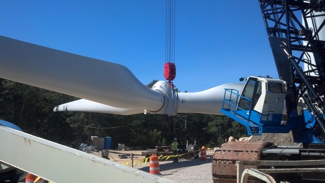 Workers install the blades of a wind turbine used to power the PAVE PAWS radar at Joint Base Cape Cod, Mass. The project was partially funded through the Energy Conservation Investment Program. (U.S. Air Force photo)
