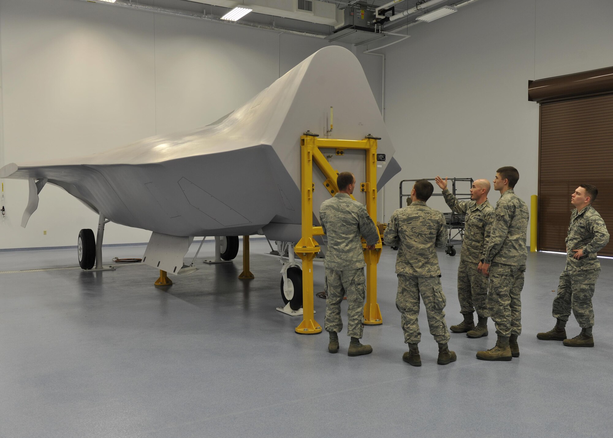 Tech. Sgt. James Harper shows students the F-22 Raptor fuels system trainer Feb. 2, 2015, at Tyndall Air Force Base, Fla. Harper trains the students so they can better understand the aircrafts fuel system. Harper is a 372nd Training Support Squadron Detachment 4 F-22 fuels system instructor. (U.S. Air Force photo/Airman 1st Class Sergio A. Gamboa)