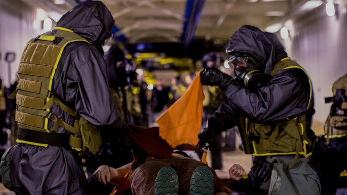 Marines and Sailors with the Chemical Biological Incident Response Force, II Marine Expeditionary Force practice their decontamination skills on a volunteer during a training evolution at the Guardian Center in Perry, Ga. on February 4, 2015.  The training aims to provide the Marines and Sailors with realistic crisis response scenarios.  (Photo by: Sgt. Fareeza Ali/USMC)