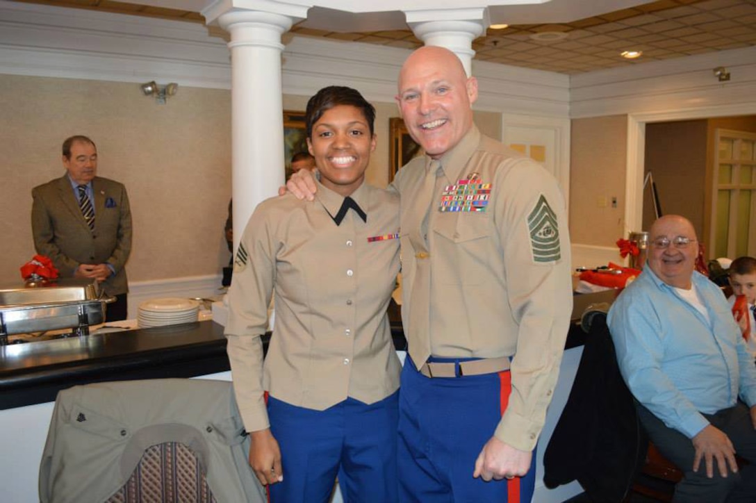 Sgt. Candice Clark-Thomas, operations noncommissioned officer, Marine Corps Systems Command, at Marine Corps Logistics Base Albany, was named the 2014 Marine Female Athlete of the Year and attends a ceremony at Marine Corps Base Quantico, Virginia, to receive her award. Sgt. Maj. Micheal P. Barrett, Sergeant Major of the Marine Corps, posed with her.
