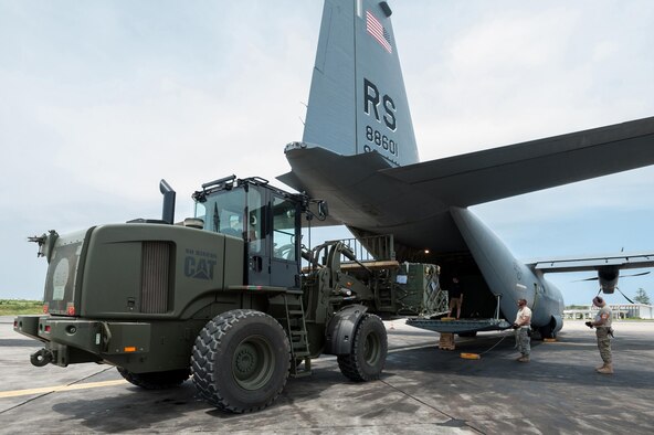 Aerial porters from the Kentucky Air National Guard’s 123rd Contingency Response Group load a pallet of red blood cells and frozen plasma Oct. 10, 2014, onto a C-130 Hercules aircraft from Ramstein Air Base, Germany, at Léopold Sédar Senghor International Airport in Dakar, Senegal. The aerial porters are part of Joint Task Force-Port Opening Senegal, an air cargo hub that’s funneling humanitarian supplies and equipment into West Africa in support of Operation United Assistance, the U.S. Agency for International Development-led, whole-of-government effort to respond to the Ebola outbreak there. (U.S. Air National Guard photo/Maj. Dale Greer)