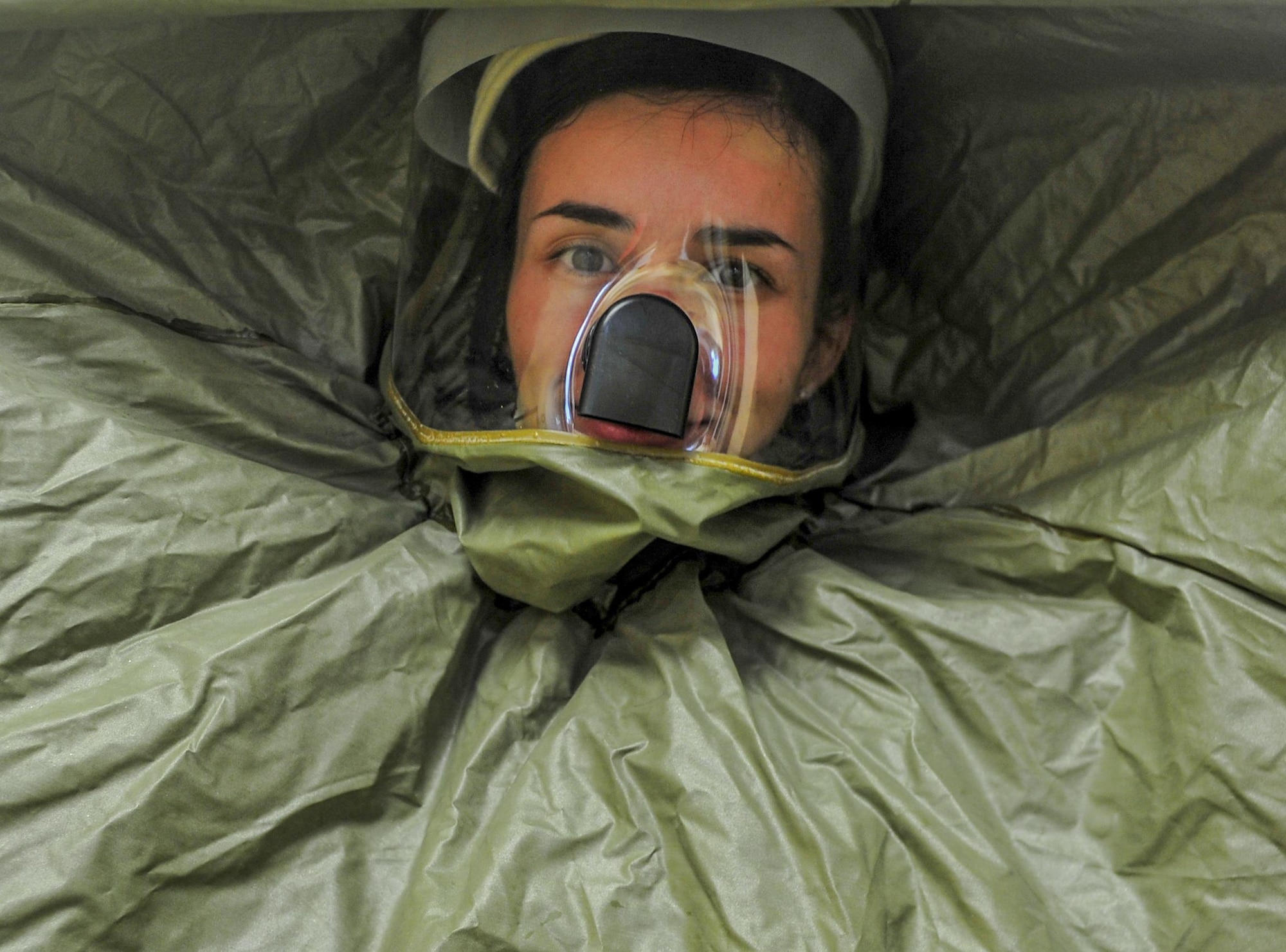 More than seven Airmen donned protective gear during a disease containment exercise at Hurlburt Field, Fla., Feb. 4, 2015. The people in protective gear annotated all simulated patients’ symptoms and escorted each patient to a separate room were they were quarantined from the rest of the building. (U.S. Air Force photo/Senior Airman Christopher Callaway) 