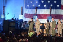 Nick Lachey and Gen. Mark Welsh, chief of staff of the Air Force, introduce Fall Out Boy during a  VH1 and Papa John's Super Bowl Blitz: A Concert for the Troops event at Luke Air Force Base, Arizona, Jan. 30, 2015. Charli XCX and Fall Out Boy came out to Luke to show support for the troops during the concert. (U.S. Air Force photo by Senior Airman James Hensley)