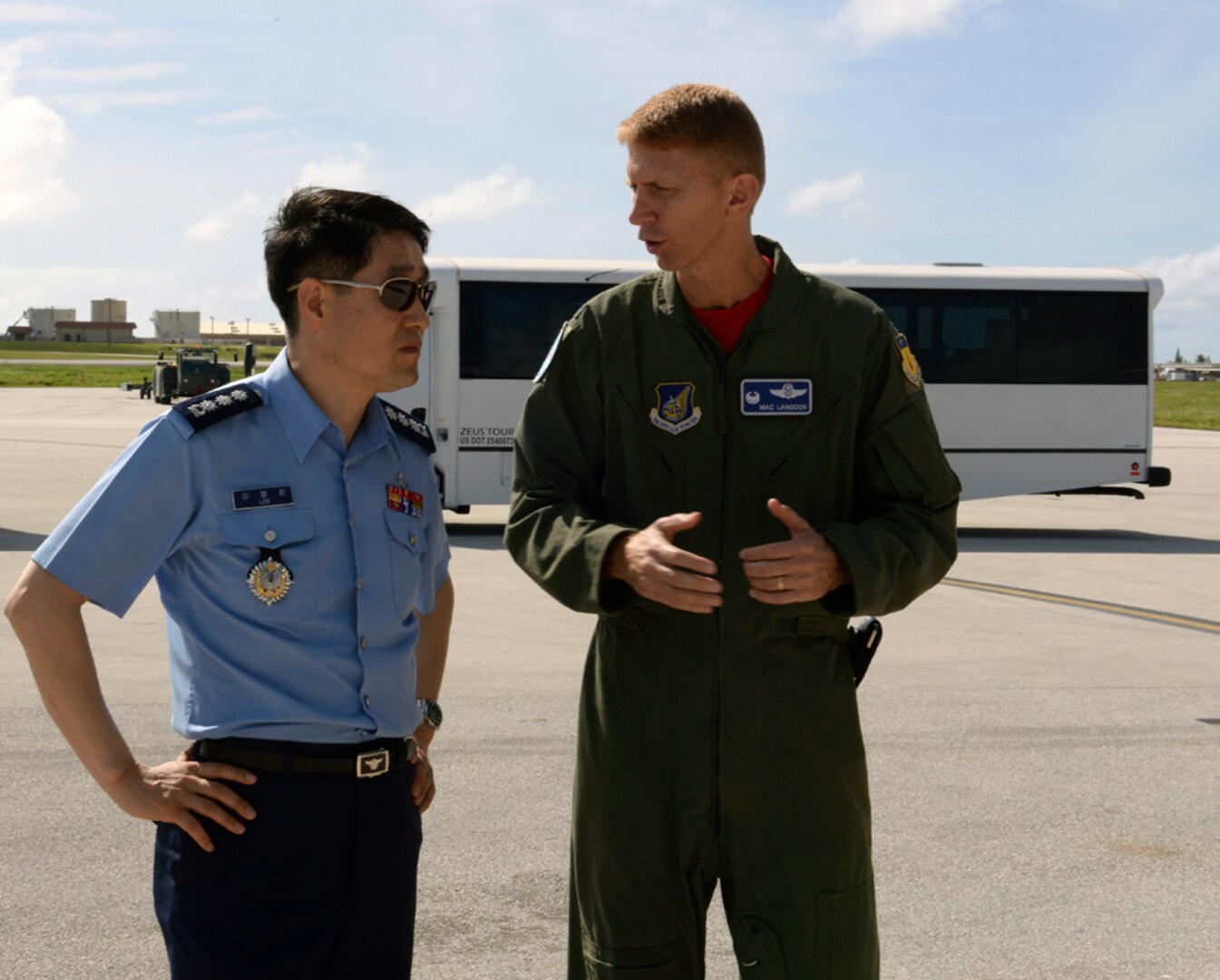 ANDERSEN AIR FORCE BASE, Guam (Jan. 30, 2015) -  U.S. Air Force Col. Reid Langdon, 36th Operations Group commander, discusses Andersen missions to a member of a Korean National Defense University class composed of nearly 100 new generals and admirals.  The class visited Andersen as a capstone event that allowed them to meet with U.S. military leaders both at Andersen and U.S. Pacific Command at Joint Base Pearl Harbor-Hickam, Hawaii, to learn about key issues and capabilities. 