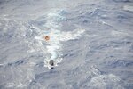 ROTA, Northern Mariana Islands (Feb. 5, 2015)- Sailors from Helicopter Sea Combat Squadron (HSC) 25, U.S. Coast Guard Sector Guam and rescue crews from Rota, 40 nautical miles north-northeast of the U.S. territory of Guam, recovered three stranded boaters a mile offshore near the village of Songsong. 