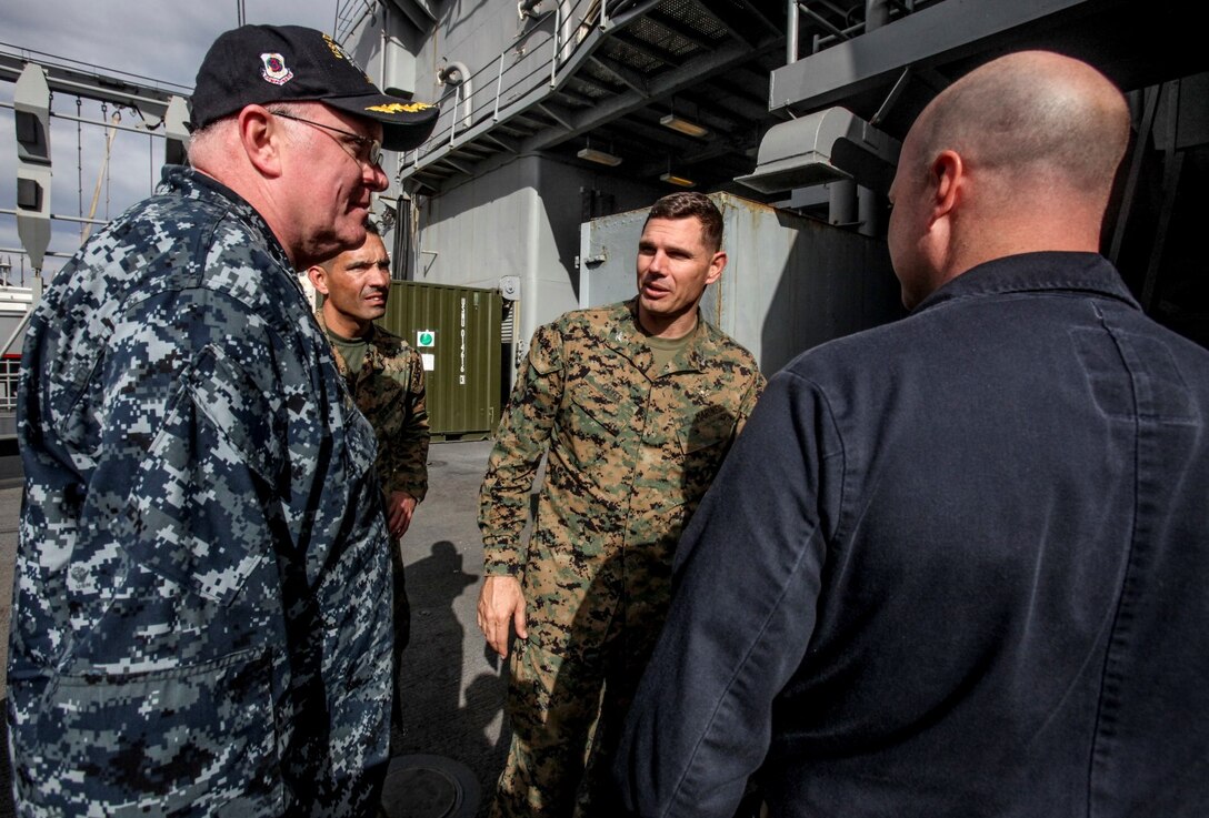 U.S. Navy Capt. Clinton Carroll , left, and Col. Vance L. Cryer discuss the current status of the training aboard the USS Rushmore (LSD 47) off the coast of Camp Pendleton, Calif., Jan. 25, 2015. Carroll is the commodore of the Essex Amphibious Ready Group. Cryer is the commanding officer of the 15th Marine Expeditionary Unit. The 15th MEU was embarked aboard the three ships of the Essex Amphibious Ready Group - the USS Essex (LHD 2), USS Anchorage (LPD 23), and USS Rushmore – from Jan. 22-25 to familiarize themselves with the ships as they continue to prepare for their upcoming deployment this spring. (U.S. Marine Corps photo by Cpl. Steve H. Lopez/Released)
