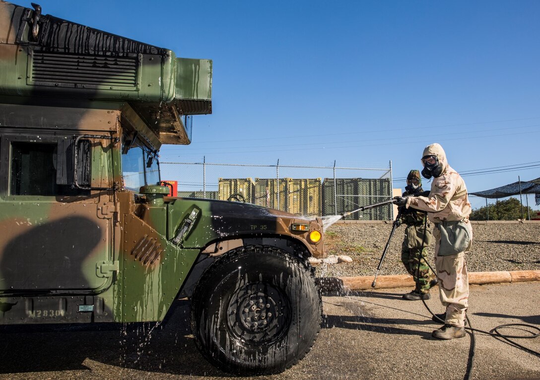 U.S. Marines with Combat Logistics Battalion 15 conduct detailed equipment decontamination during a reconnaissance, surveillance and decontamination course aboard Camp Pendleton, Calif., Feb. 4, 2015. As the logistics combat element for the 15th Marine Expeditionary Unit, CLB-15 is training to ensure readiness for any situation they may encounter during their upcoming deployment this spring. (U.S. Marine Corps photo by Sgt. Emmanuel Ramos/Released)