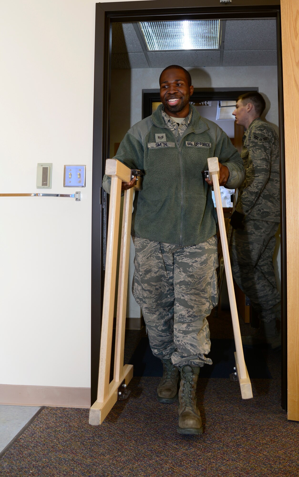U.S. Air Force Staff Sgt. Willet Smith, a contingency dorm prep volunteer, moves bedframe parts for future dorm residents Feb. 5, 2014, at Eielson Air Force Base, Alaska. Fourteen Icemen volunteers helped with assembling and moving furniture after a recent renovation. (U.S. Air Force photo by Senior Airman Racheal E. Watson/Released) 