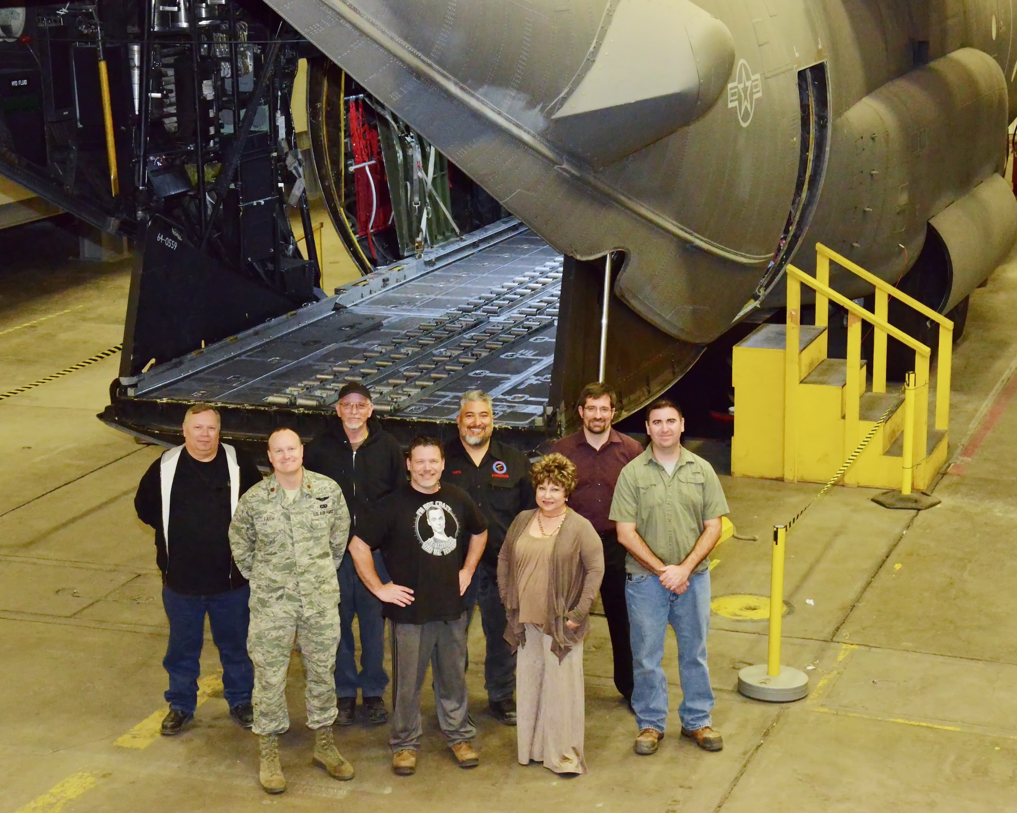 The group responsible for putting together the MC-130H training apparatus to Kirtland, and saving the Air Force millions of dollars, stand by the device. From left, are John Nakos, Maj. Rob Faith, Larry Crow, John Degroat, Anthony Tapia, Julie Sedillo, Jonathan Andrews and Maynard Oselio. (Photo by Jamie Burnett)