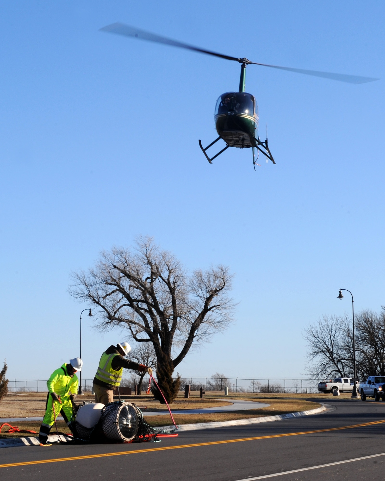 A helicopter takes off after unloading an airfield beacon from the base water tower, Feb. 3, at McConnell Air Force Base, Kan. The airfield beacon indicates the location of a military installation’s airfield to pilots during night missions. The old beacon was nearing the end of its service life and had to be replaced before it failed. (U.S. Air Force photo/Airman 1st Class David Bernal Del Agua)