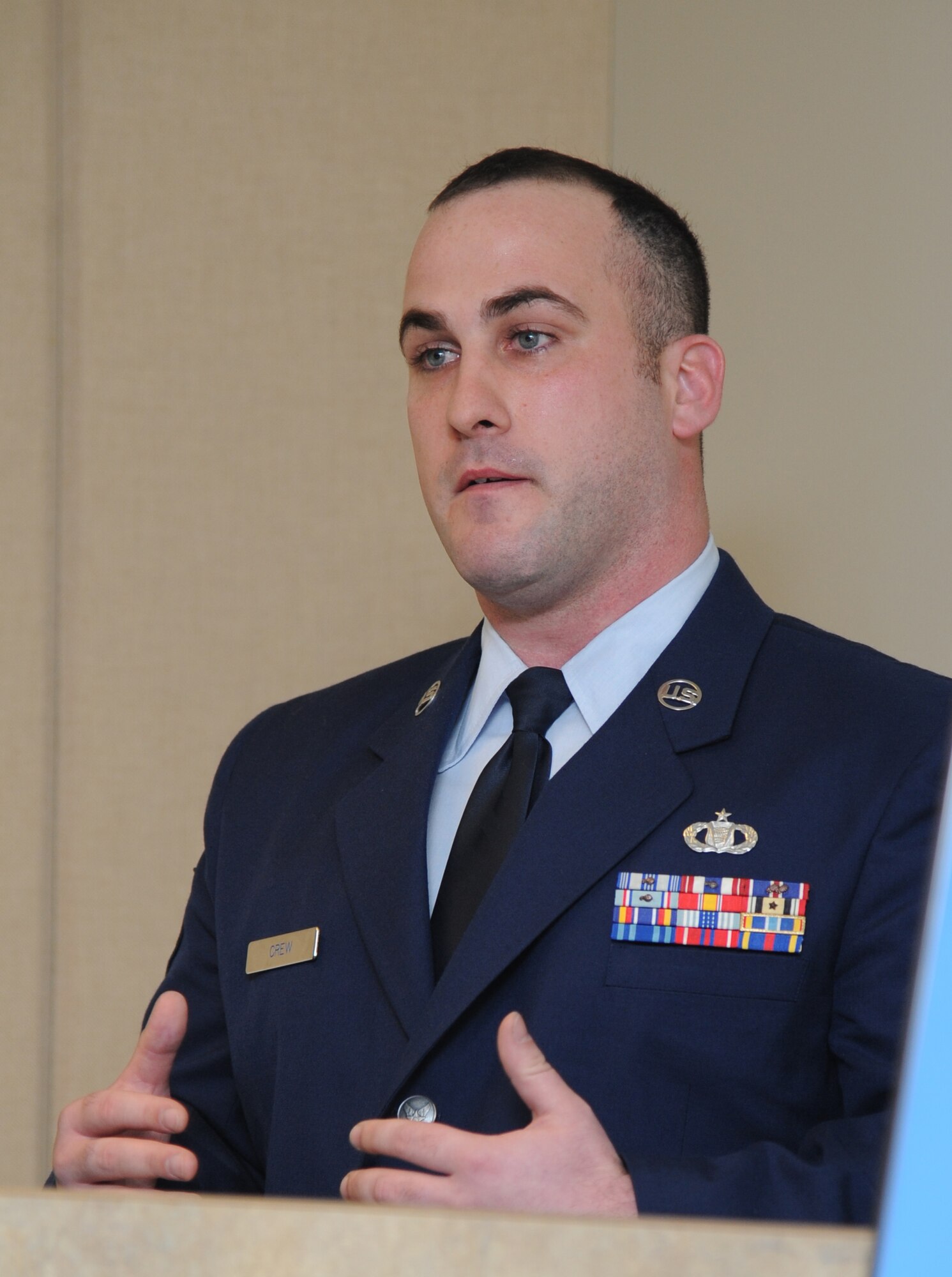Staff Sgt. William Crew, 573rd Global Support Squadron airfield survey team chief, Travis Air Force Base, Calif., delivers remarks during a dedication ceremony to honor Senior Airman James Hansen Feb. 4, 2015, at Cody Hall, Keesler Air Force Base, Miss.  Hansen was killed in combat in Iraq on Sept. 15, 2010.  He was an airfield management operations coordinator who received his initial technical training from the 334th Training Squadron here.  A training room was dedicated during the event. (U.S. Air Force photo by Kemberly Groue)