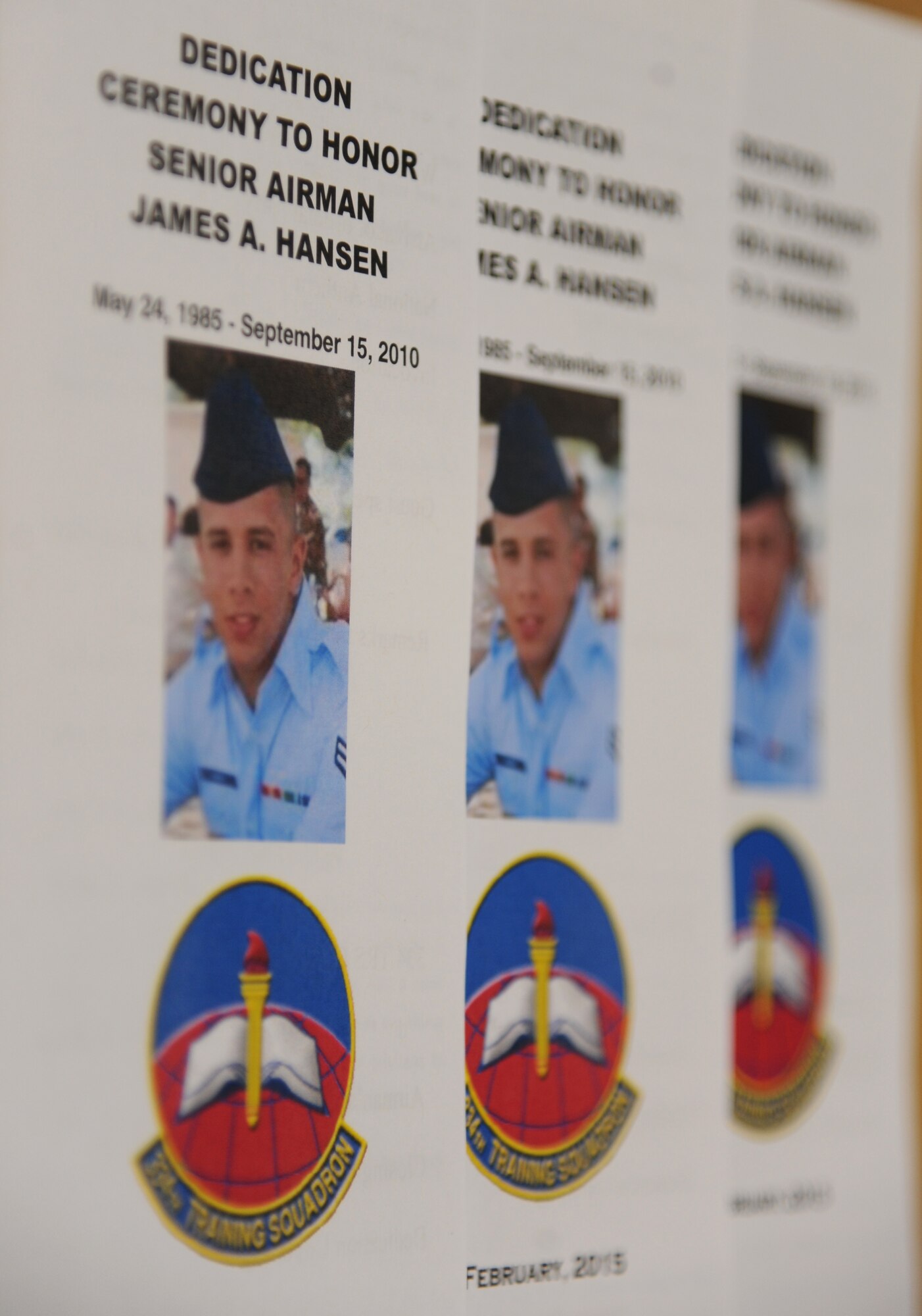 Event programs are displayed during a dedication ceremony to honor Senior Airman James Hansen Feb. 4, 2015, at Cody Hall, Keesler Air Force Base, Miss.  Hansen was killed in combat in Iraq on Sept. 15, 2010.  He was an airfield management operations coordinator who received his initial technical training from the 334th Training Squadron here.  A training room was dedicated in his memory during the event. (U.S. Air Force photo by Kemberly Groue)