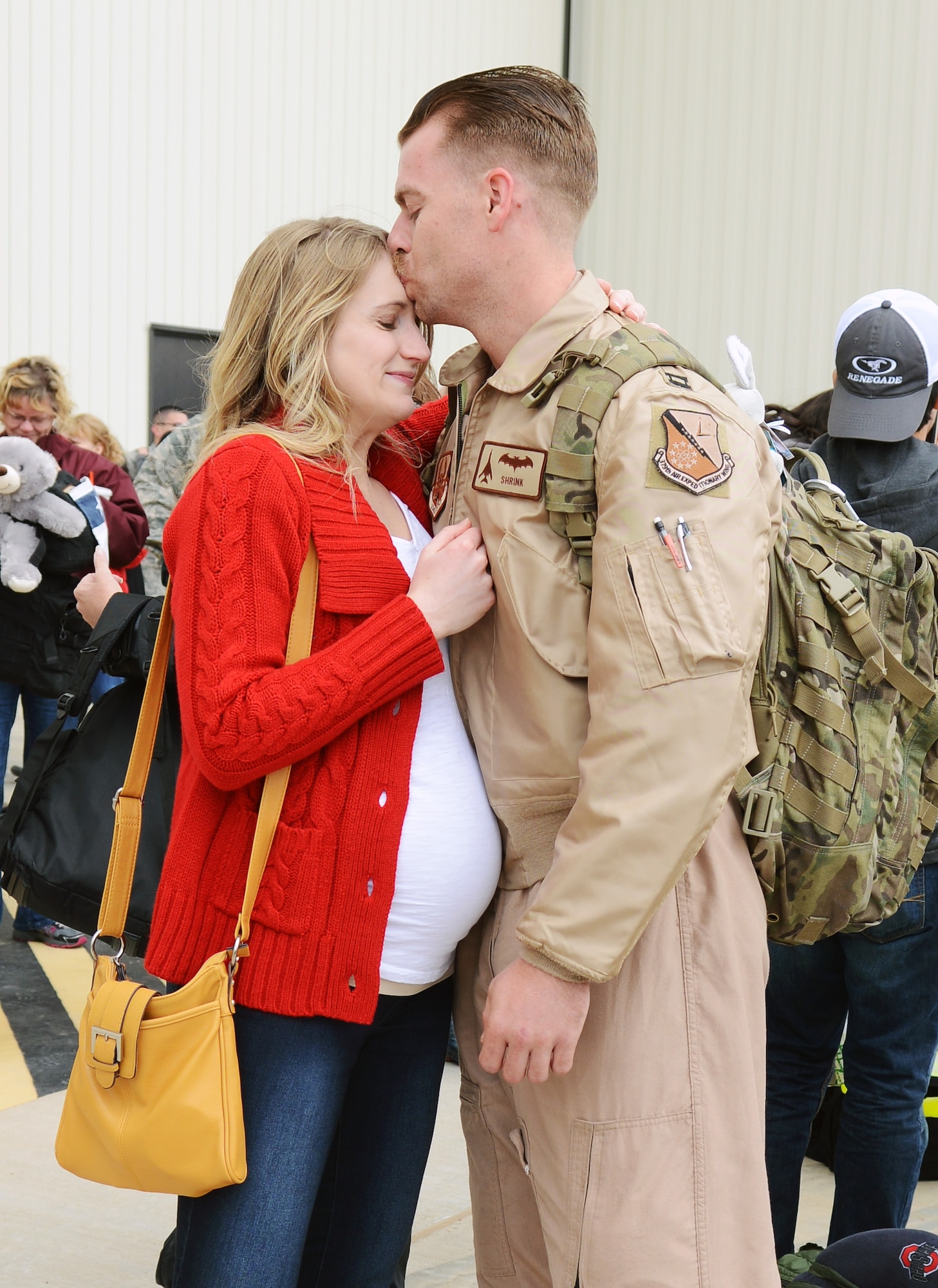 U.S. Air Force Capt. Tim, 9th Bomb Squadron, reunites with his wife, Bridget, after returning from a deployment to Al Udeid Air Base, Qatar, Feb. 1, 2015, at Dyess Air Force Base, Texas. Dyess Airmen from the 9th BS, 7th Maintenance Group and 7th Operations Support Squadron served six months in the U.S. Central Command area of responsibility. This is the 9th BS’s second deployment in a year and a half. (U.S. Air Force photo by Airman 1st Class Kedesha Pennant/Released)