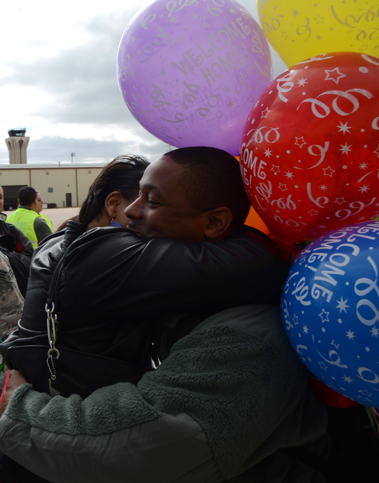 U.S. Air Force Tech. Sgt. Gregory Johnson, 7th Munitions Squadron, is greeted by his wife, Demetria, after returning from a six-month deployment Feb. 1, 2015, at Dyess Air Force Base, Texas. Approximately 350 Dyess Airmen deployed to Al Udeid Air Base, Qatar in support of Operation Enduring Freedom, Operation Freedom’s Sentinel and Operation Inherent Resolve. (U.S. Air Force photo by Airman 1st Class Kedesha Pennant/Released)