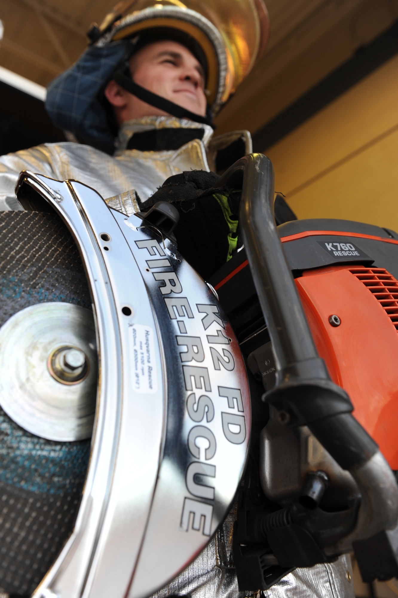 Senior Airman Cody Malia 99th Civil Engineer Squadron fire protection journeyman displays a rescue saw at Fire Station 1 at Nellis Air Force Base, Nev., Feb. 2, 2015. The saw is primarily used to remove aircraft canopies if the pilot or rescue workers are unable to open them manually in emergency situations. (U.S. Air Force photo by Staff Sgt. Victoria Sneed)