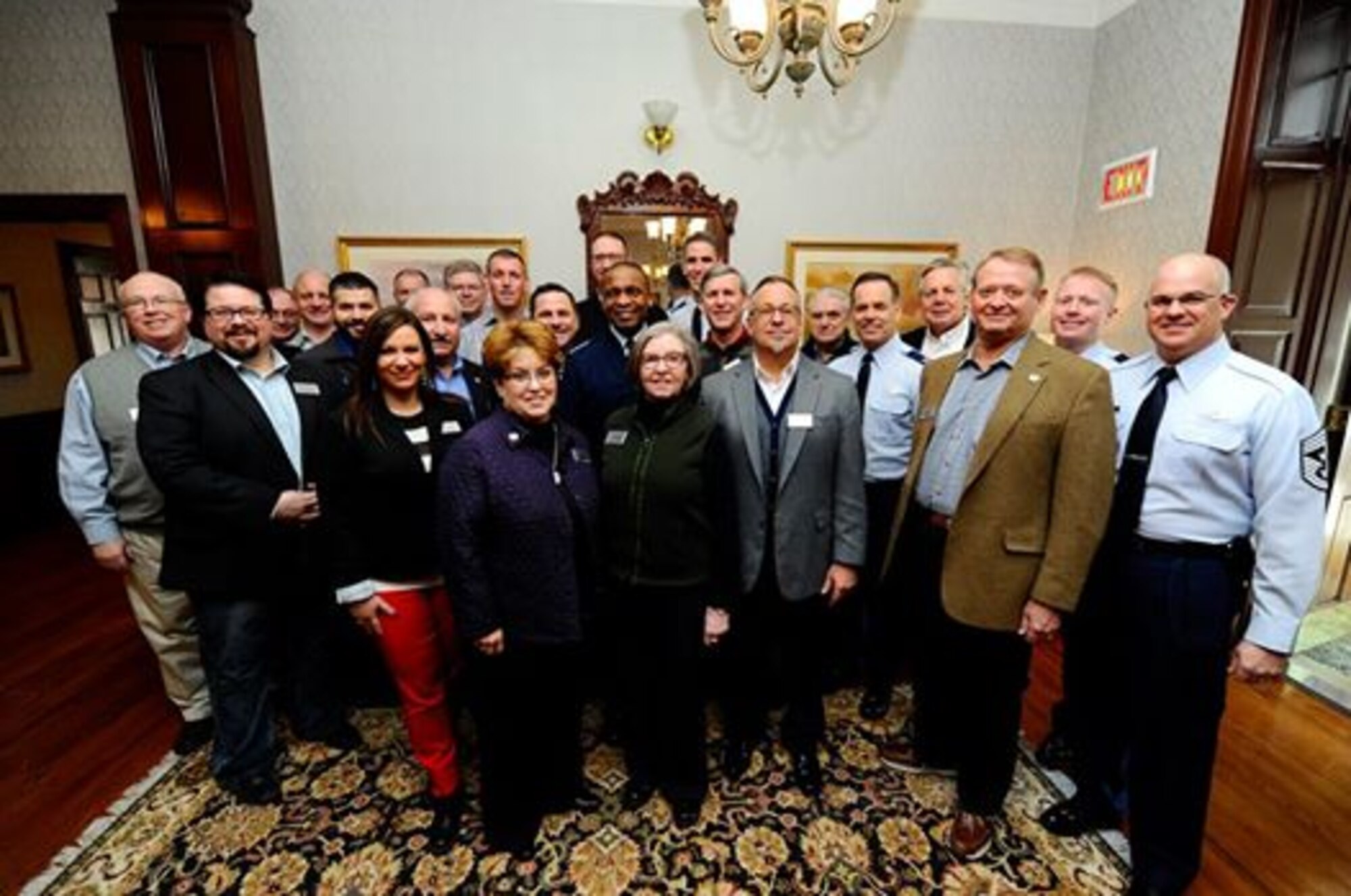 Business leaders from the Wichita area pose for a photo with members from McConnell and Air Mobility Command as part of a civic leader tour at Scott Air Force Base, Ill., Feb. 3, 2015.  More than 20 business leaders participated in McConnell's first civic leader tour in more than three years.  (U.S. Air Force photo by Senior Airman Victor Caputo)