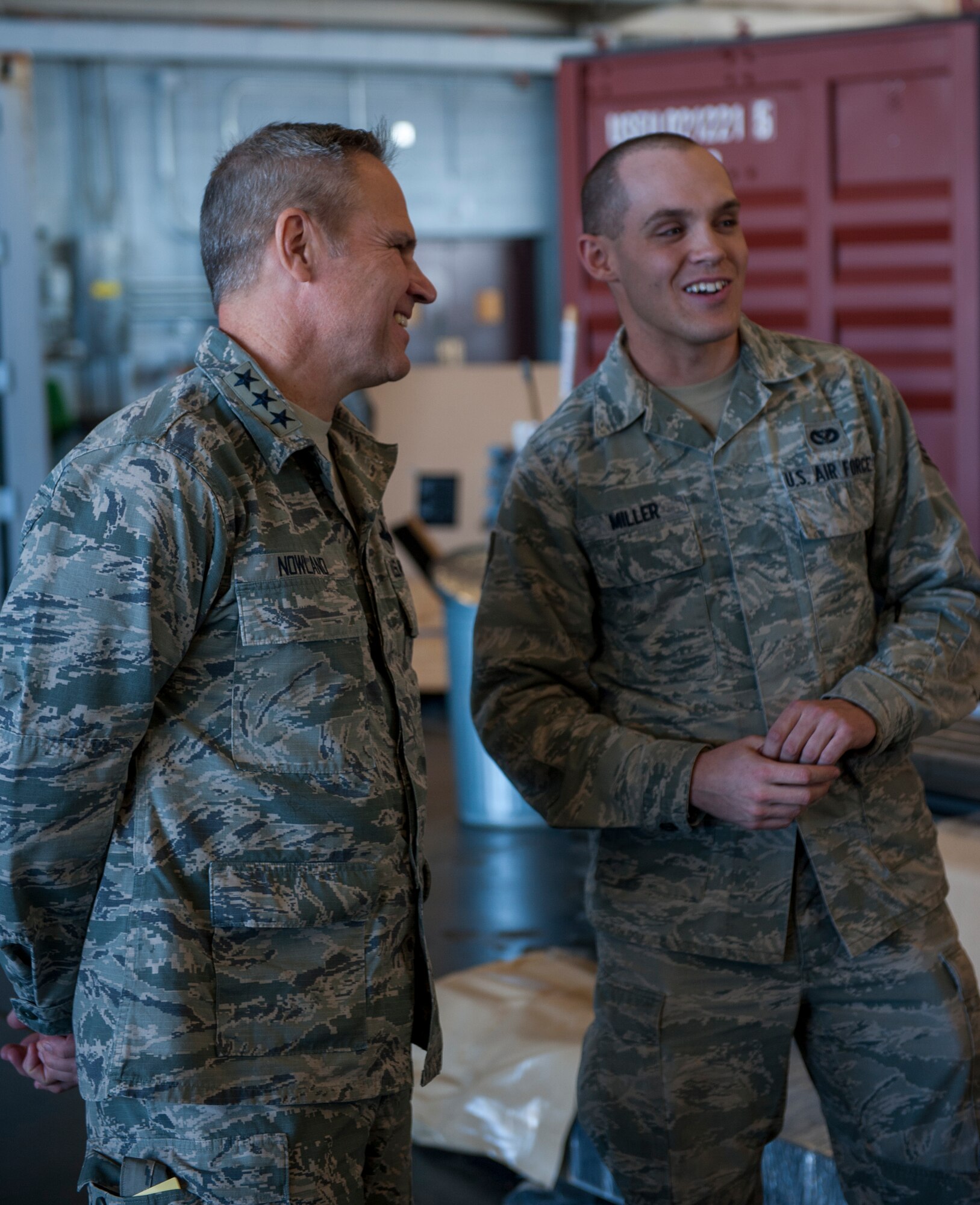 Lt. Gen. Chris Nowland, 12th Air Force commander laughs with Senior Airman Ronald Miller III, 49th Materiel Maintenance Squadron, during his tour of Basic Airfield Expeditionary Resources base Feb. 4, 2015 at Holloman Air Force Base, N.M. A team from the 49th MMS briefed about BEAR base capabilities and how their assets are essential to providing support to personnel deployed downrange. (U.S. Air Force photo by Airman 1st Class Emily A. Kenney/Released)