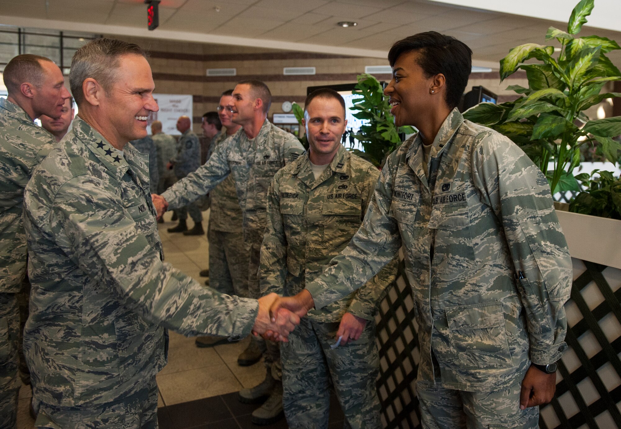 Lt Gen. Chris Nowland, 12th Air Force commander congratulates 1st Lt. Angele Montfort, 49th Logistics Readiness Squadron fuels flight commander, Feb. 4, 2015 at Holloman Air Force Base, N.M. Montfort was recognized for winning the wing quarterly award for company grade officers because of her superior performance. (U.S. Air Force photo by Airman 1st Class Emily A. Kenney/Released)