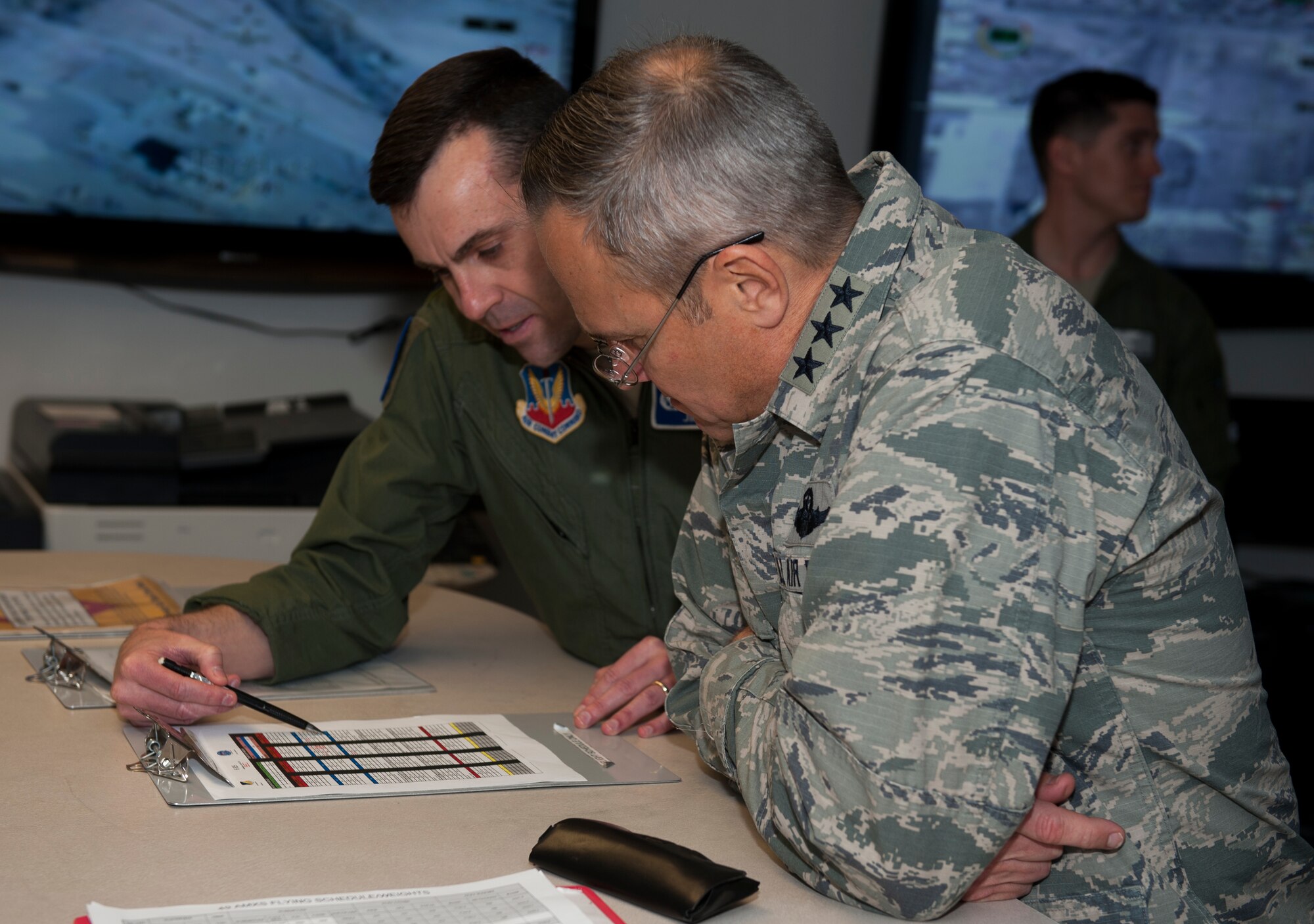 Lt. Col. James Price, 6th Reconnaissance Squadron commander, reviews 6th RS logistics with Lt. Gen. Chris Nowland, 12th Air Force commander, Feb. 4, 2015 at Holloman Air Force Base, N.M. During Nowland’s tour of Holloman, he visited numerous units on Holloman and learned how each unit is essential to the mission of the base. (U.S. Air Force photo by Airman 1st Class Emily A. Kenney/Released)
