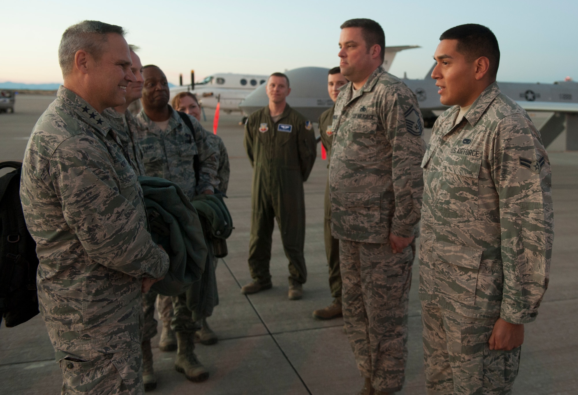 Lt. Gen. Chris Nowland, 12th Air Force commander, greets Airman 1st Class Luis Bedoya III, an aerospace ground equipment technician from the 49th Maintenance Squadron, after arriving at Holloman Air Force Base, N.M. Feb. 3, 2015. Nowland congratulated Bedoya for winning the 49th MXG Airman of the year. (U.S. Air Force photo by Airman 1st Class Emily A. Kenney/Released)