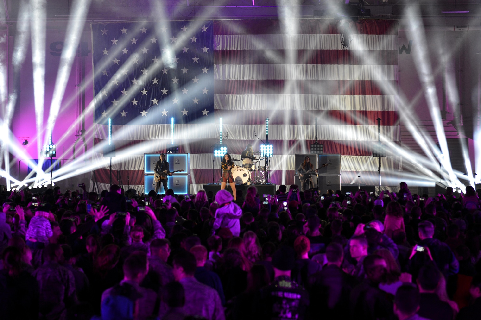 Luke Air Force Base Thunderbolts gather around the stage to watch Charli XCX at the Papa John’s VH1 Super Bowl Blitz concert Jan. 30 in Hangar 999. The concert, hosted by former 98 Degrees band member Nick Lachey, was to show appreciation for the troops. (U.S. Air Force photo/Airman Pedro Mota)