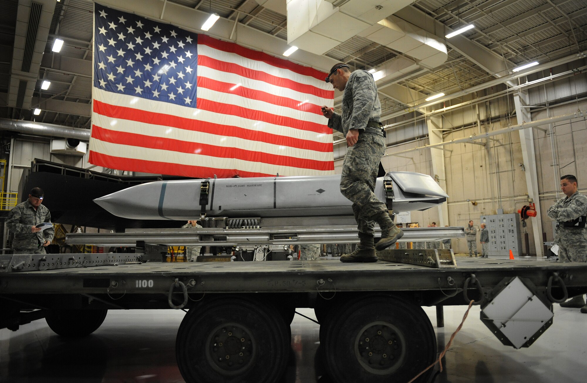 U.S. Air Force Staff Sgt. Joseph Herdliska, 131st Aircraft Maintenance Squadron load crew member, prepares to load an AGM-158 Joint Air-to-Surface Standoff Missile onto the B-2 Spirit weapons load trainer during a weapons load competition at Whiteman Air Force Base, Mo., Jan. 23, 2015. The competition is designed to showcase the teamwork, precision and attention to detail amongst Airmen in support of nuclear deterrence and global strike operations. (U.S. Air Force photo by Airman 1st Class Joel Pfiester/Released)
