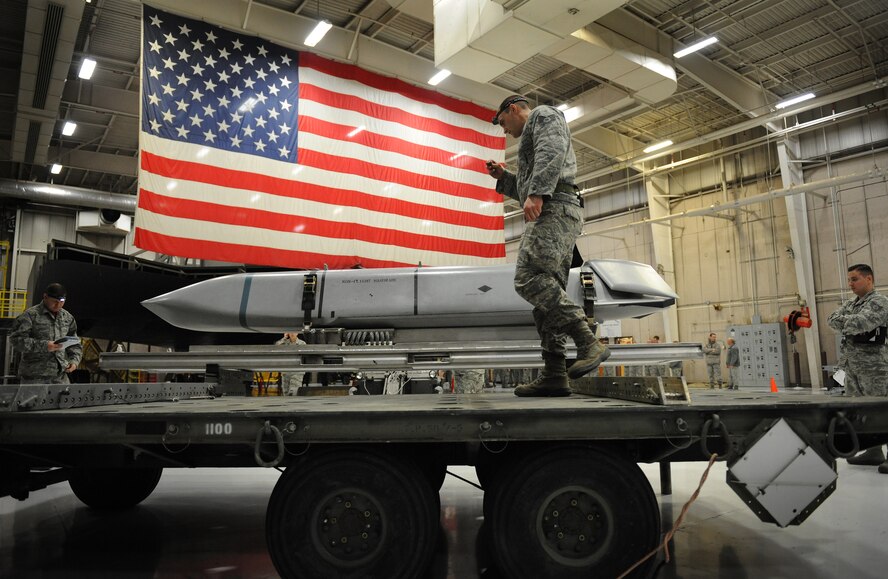 U.S. Air Force Staff Sgt. Joseph Herdliska, 131st Aircraft Maintenance Squadron load crew member, prepares to load an AGM-158 Joint Air-to-Surface Standoff Missile onto the B-2 Spirit weapons load trainer during a weapons load competition at Whiteman Air Force Base, Mo., Jan. 23, 2015. The competition is designed to showcase the teamwork, precision and attention to detail amongst Airmen in support of nuclear deterrence and global strike operations. (U.S. Air Force photo by Airman 1st Class Joel Pfiester/Released)
