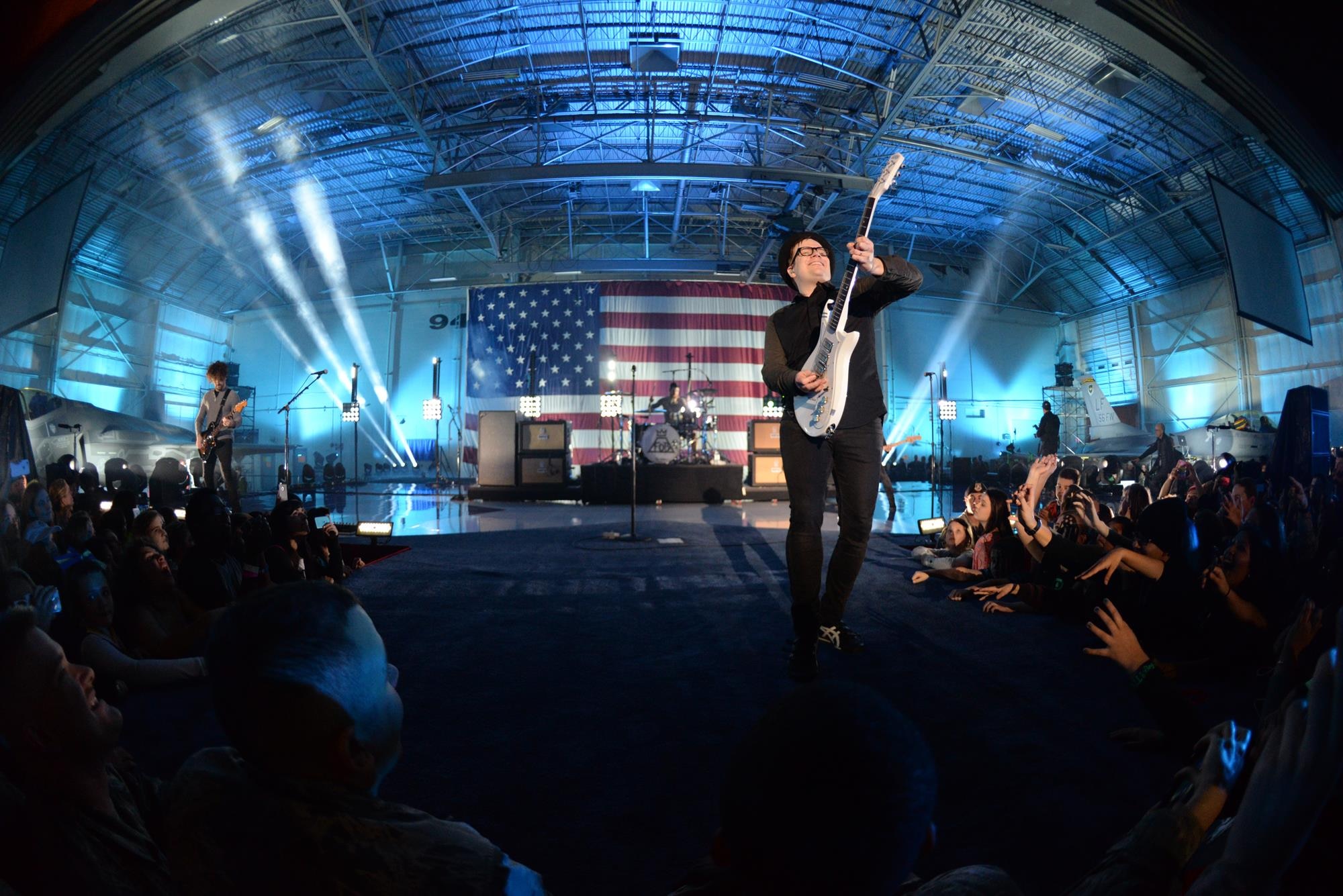 Fall Out Boy lead singer and guitarist Patrick Stump excites the crowd during the concert. In addition to performing, the band showed their support with words of thanks, autographs and guitar picks tossed to the crowd. (U.S. Air Force photo/Staff Sgt. Nestor Cruz)