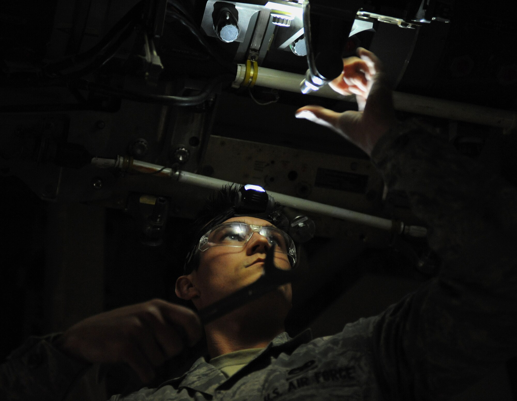 U.S. Air Force Senior Airman Ryan Minner, 13th Aircraft Maintenance Unit load crew member, prepares the B-2 Spirit weapons load trainer during a weapons load competition at Whiteman Air Force Base, Mo., Jan. 23, 2015. The competition is designed to showcase the teamwork, precision and attention to detail amongst Airmen in support of nuclear deterrence and global strike operations. (U.S. Air Force photo by Airman 1st Class Joel Pfiester/Released)