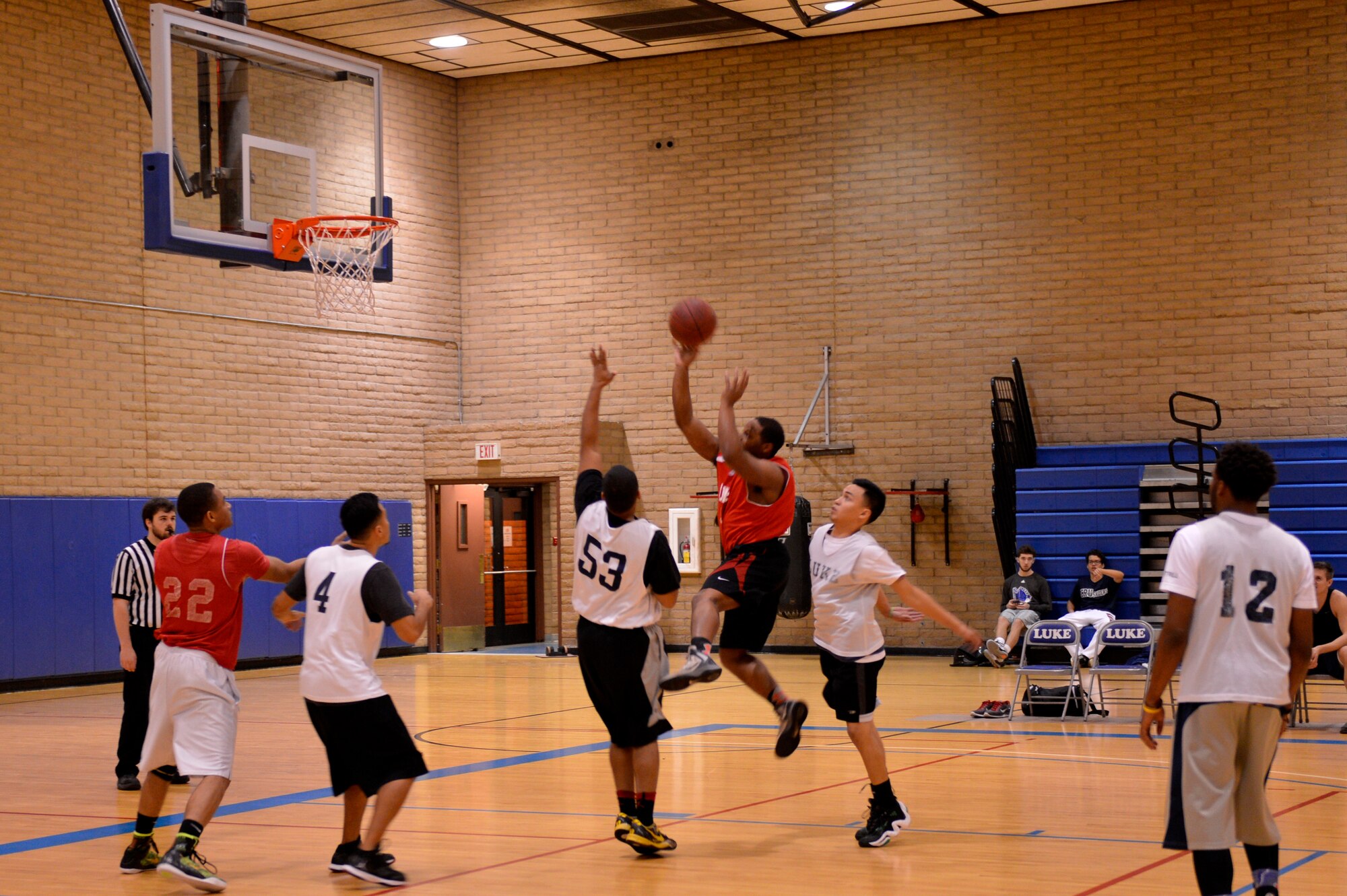 Mark Lane, 56th Force Support Squadron, member of the 56th Fighter Wing Staff Agencies team, floats the ball to the hoop Jan. 28 at Luke Air Force Base. (U.S. Air Force photo/Airman Pedro Mota)